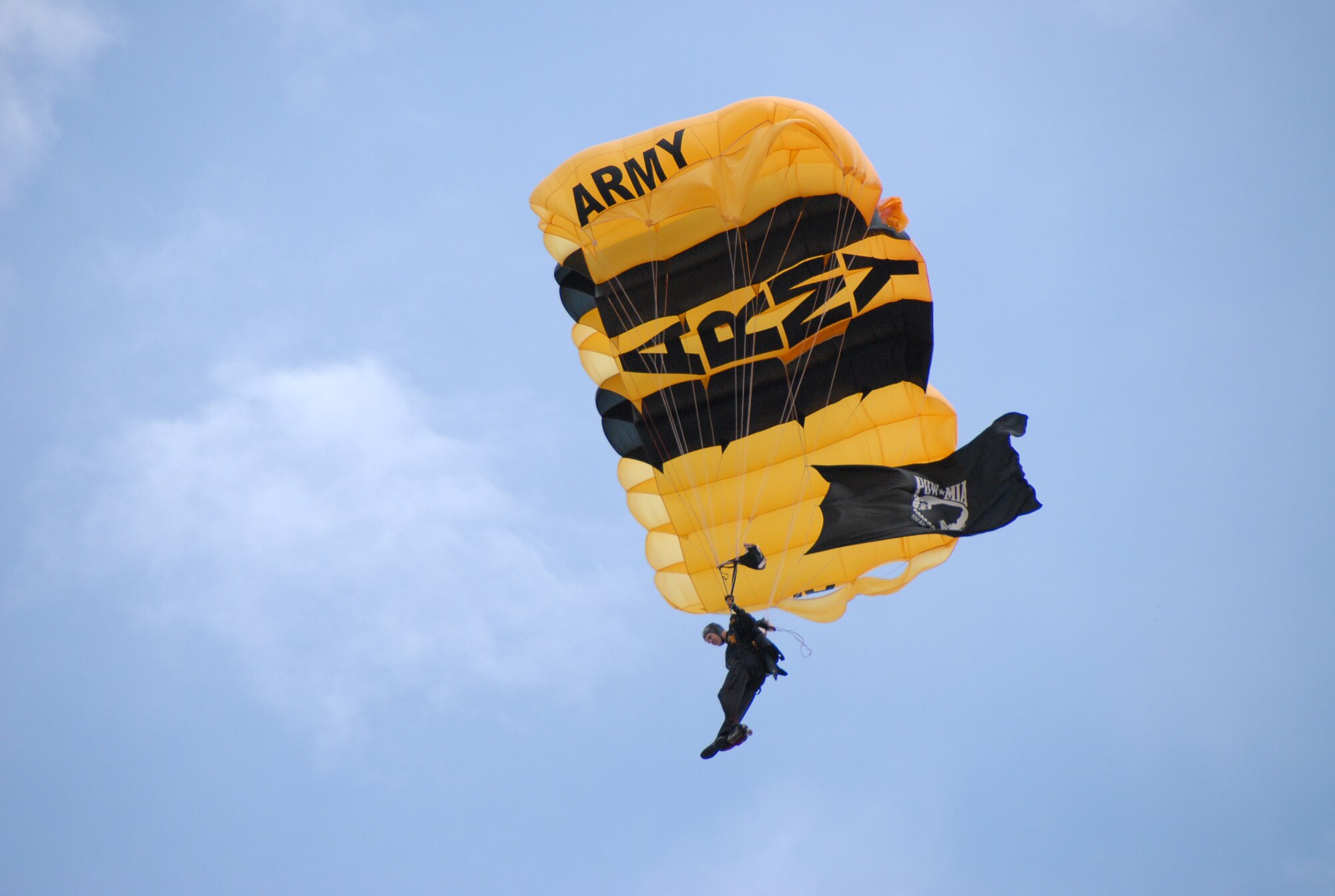 A member of the Golden Knights carries the POW/MIA flag to the ground during the Robins Air Show May 2. U. S. Air Force photo by Wayne Crenshaw