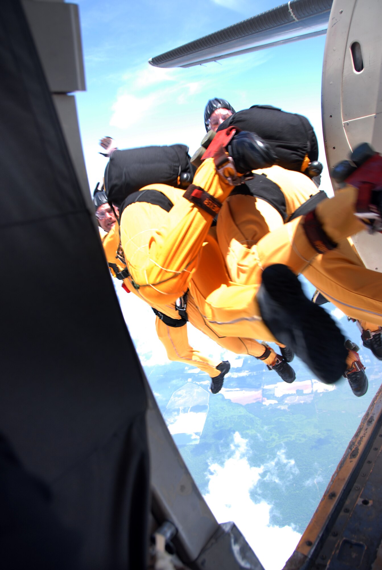 Golden Knights team members exit the aircraft for  a practice jump May 1 in preparation for the Robins Air Show.  U.S. Air Force photo by Wayne Crenshaw