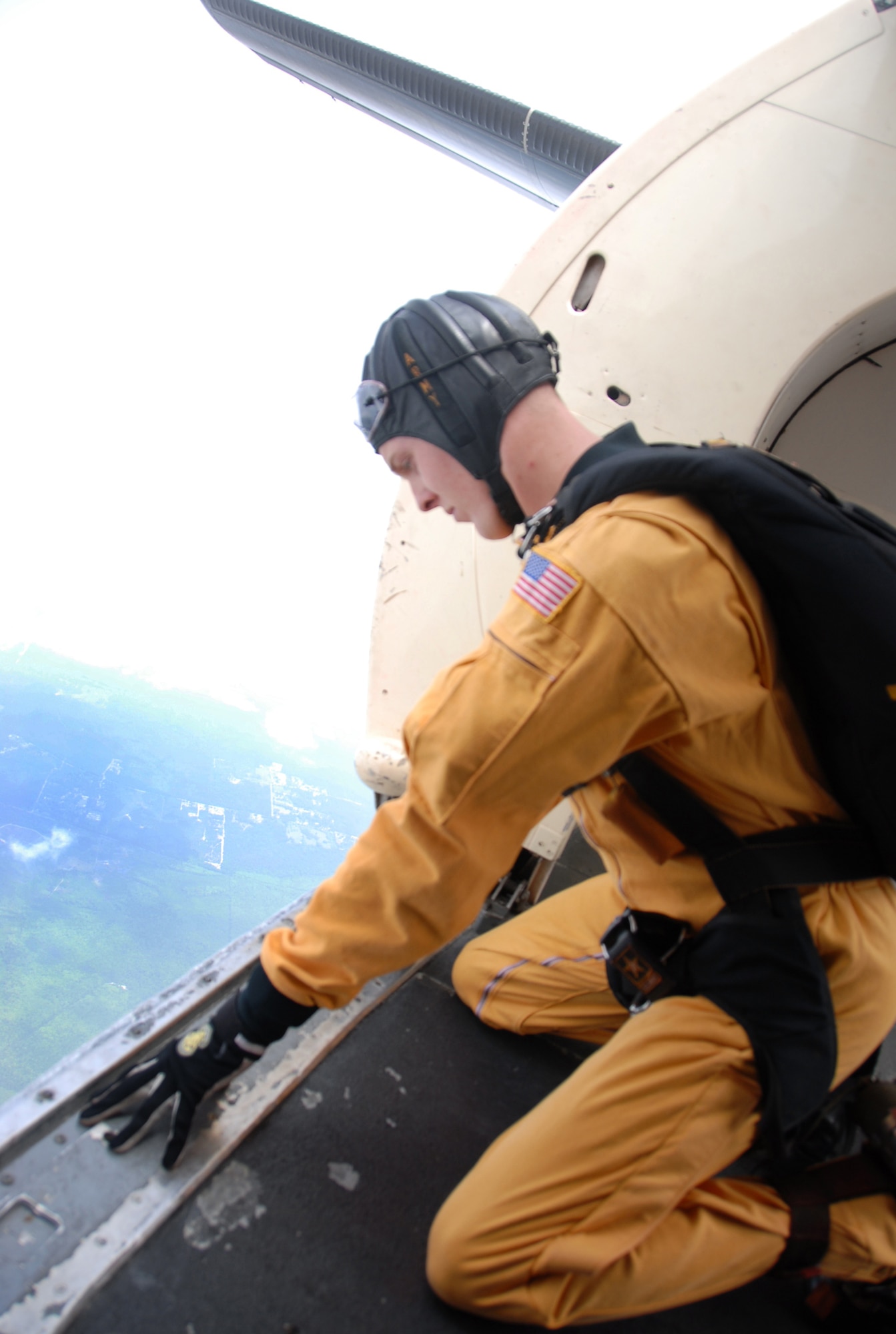 Sgt. Daniel Cook, a Golden Knights team member, takes a look at the landscape, checking to ensure the team is in the right location before making a practice jump May 1. U.S. Air Force photo by Wayne Crenshaw