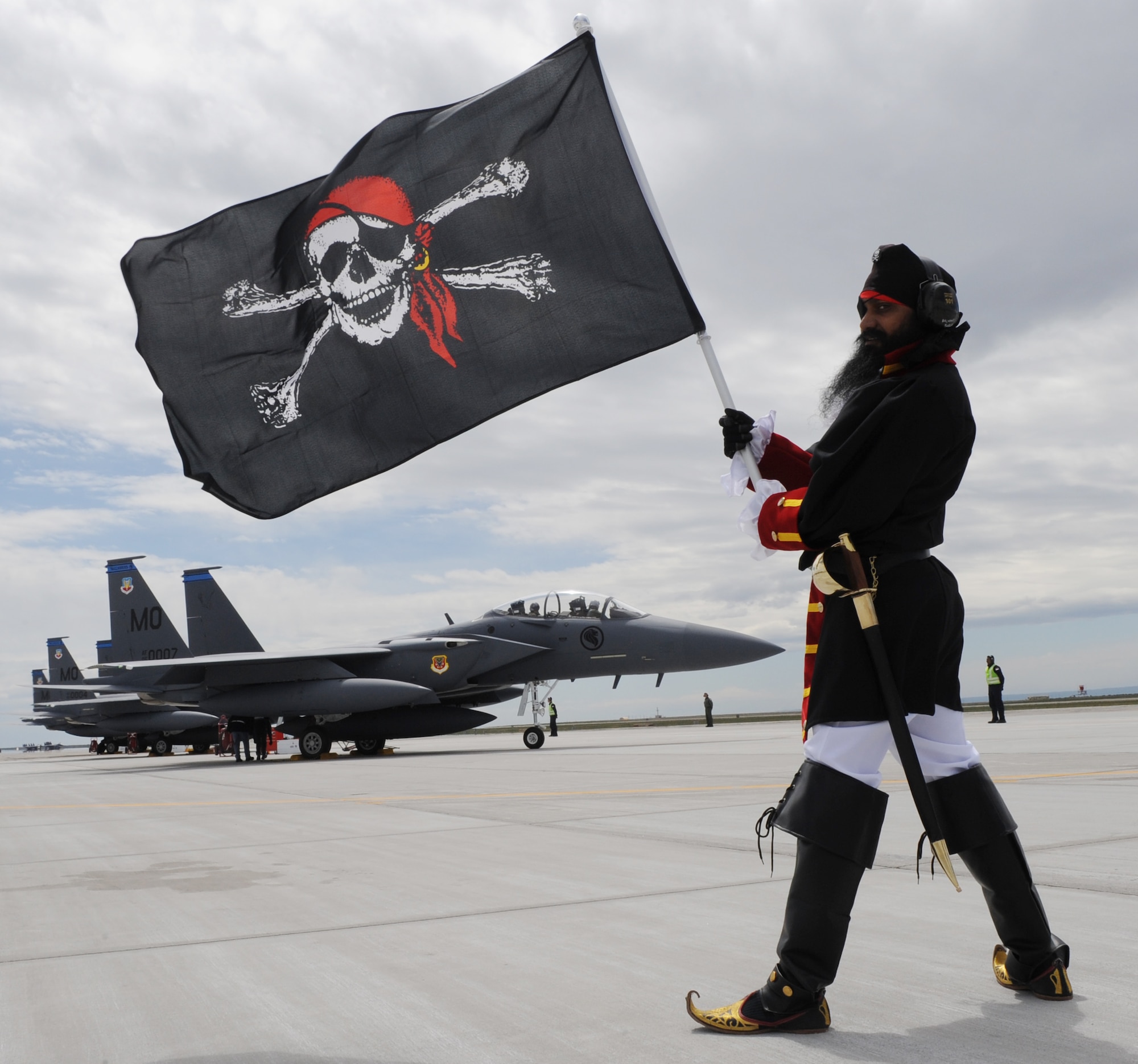 MOUNTAIN HOME AIR FORCE BASE, Idaho - The 428th Fighter Squadron "Buccaneer" mascot poses in front of three F-15SG fighter jets belonging to the Republic of Singapore air force May 6. During a ceremony May 18, the 366th Fighter Wing, in conjunction with the Republic of Singapore air force, will officially activate the 428th Fighter Squadron “Buccaneers” here. The unit will include approximately 180 active duty and 130 support personnel as part of a long-standing partnership with the United States to train its aircrews. Over the life of the program, as many as 2,000 active duty RSAF personnel will live and work on the base. (U.S. Air Force photo/ Airman 1st Class Renishia Richardson)