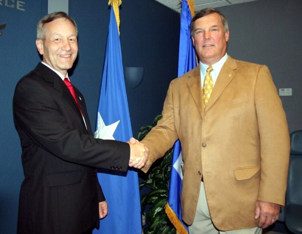 (L-R) Brig. Gen. Eric W. Crabtree is congratulated by Maj. Gen. Robert E. Duignan (Ret.) folloiwng a ceremony where General Duignan presented a Senior Executive Service lapel  pin to his predecessor, 4th Air Force Commander General Crabtree.  The April 30th ceremony at 4th AF was attended by the headquarters staff.  (U.S. Air Force photo/2Lt. Zachary L. Anderson) 