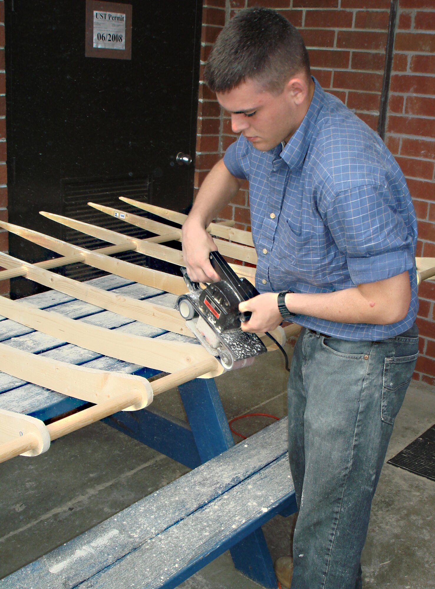An Air Force Junior ROTC cadet from SouthWest Edgecombe High School, N.C., dedicated more than a year of planning and building to construct a replica of the Wright Flyer in December 2008 after visiting the Wright Brothers' memorial in Kitty Hawk, N.C. The unit was granted a Bright Ideas Grant worth $483, and raised an additional $2,000 toward the project through fundraisers. (Courtesy photo) 
