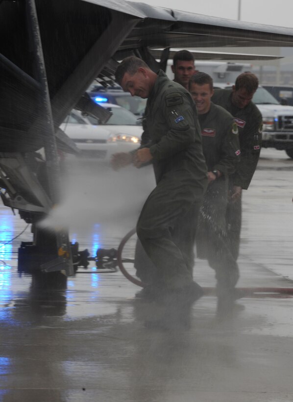 LANGLEY AIR FORCE BASE, Va. -- Brig. Gen. Mark A. Barrett, 1st Fighter Wing commander, gets hosed down during his final flight here May 6. A fini flight is a military aviation tradition celebrated by aircrews taking their last flight with their unit.  (U.S. Air Force photo/Senior Airman Ashley Hawkins)
