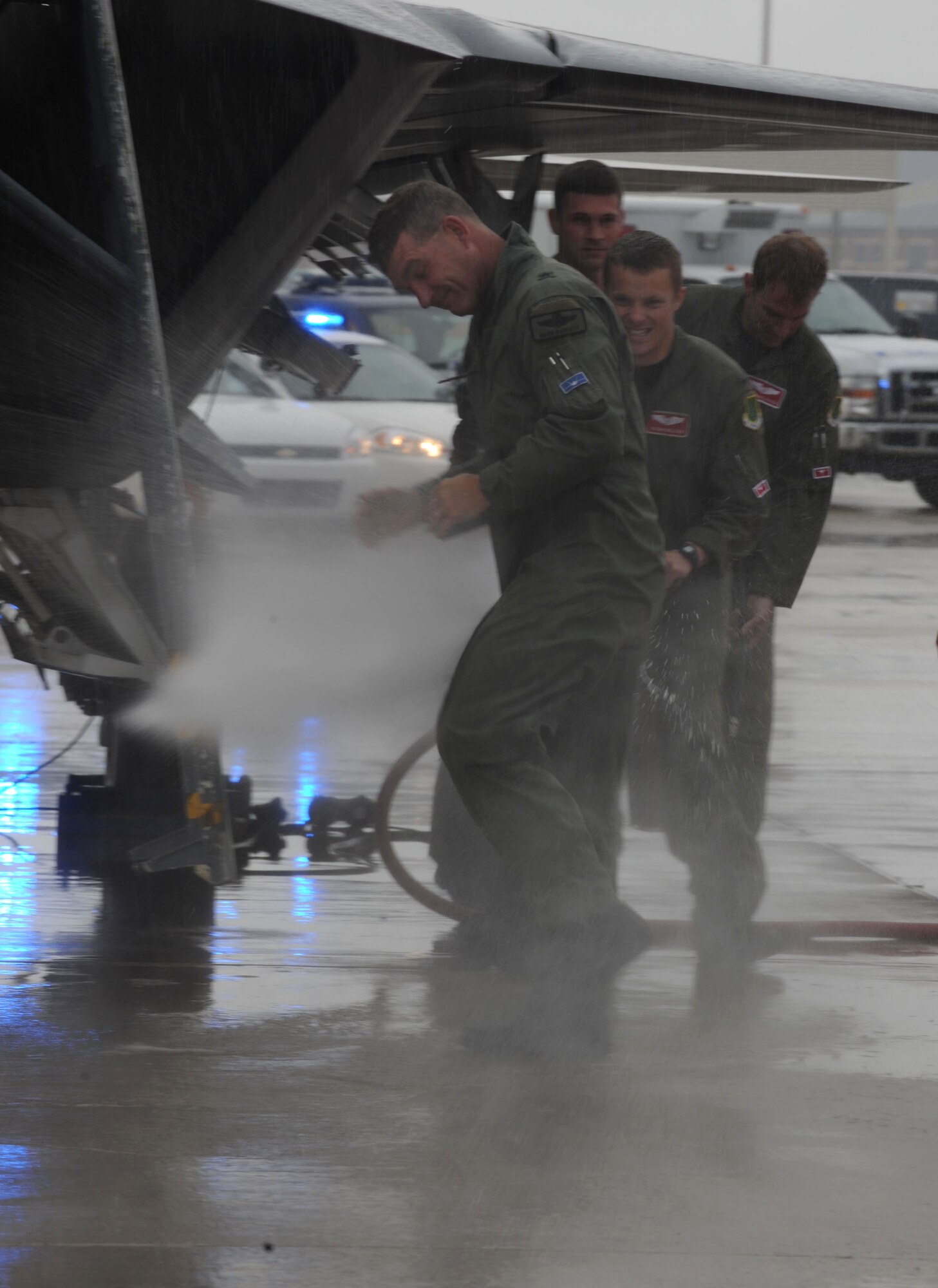 LANGLEY AIR FORCE BASE, Va. -- Brig. Gen. Mark A. Barrett, 1st Fighter Wing commander, gets hosed down during his final flight here May 6. A fini flight is a military aviation tradition celebrated by aircrews taking their last flight with their unit.  (U.S. Air Force photo/Senior Airman Ashley Hawkins)
