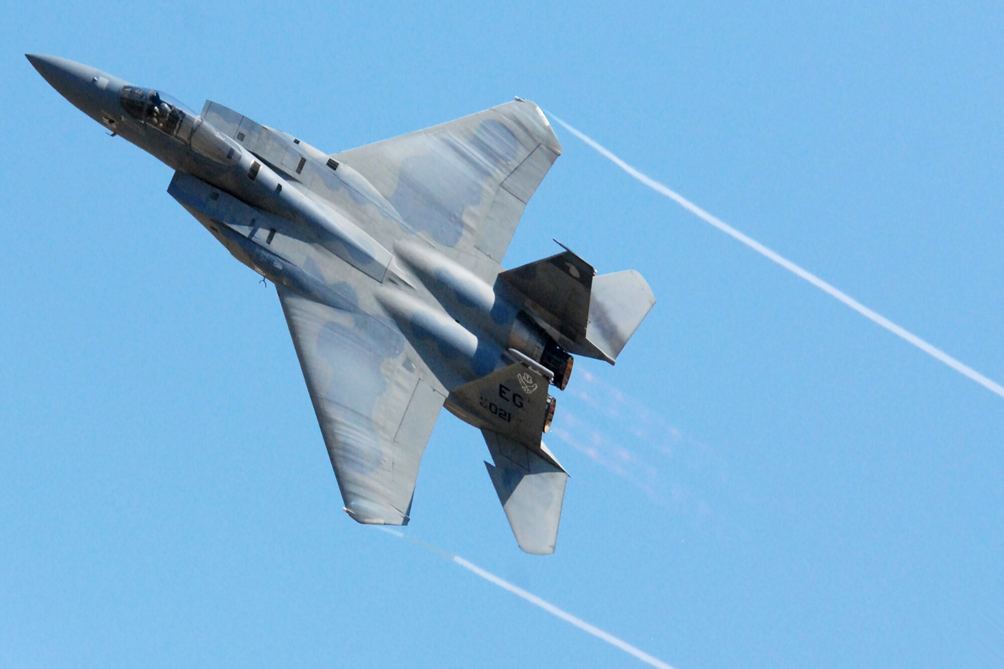 Capt. Sam Joplin performs aerial maneuvers in an F-15 Eagle to display the capabilities of the fighter to hundreds of base and community spectators during a demonstration May 1 at Eglin Air Force Base, Fla. The Air Combat Command demo team has performed more than 150 times to spectators around the globe over the last two years. This is the final demonstration for the F-15C, completing a 26-year career that began in 1983. Captain Joplin is an F-15 West Coast Demonstration Team pilot. (U.S. Air Force photo/Staff Sgt. Mike Meares)

