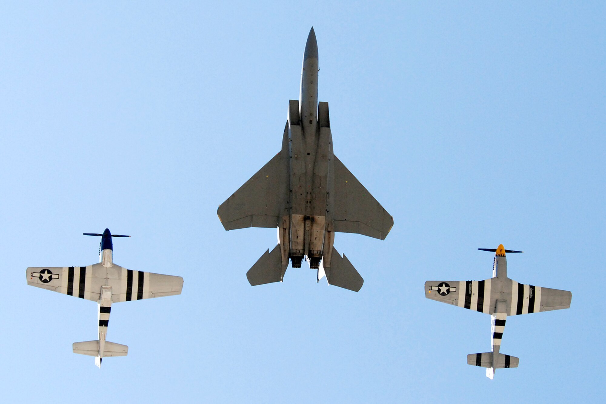 The F-15 Eagle West Coast Demonstration Team and a pair of P-51 Mustangs fly in formation as part of the Heritage Flight during their final demonstration May 1 at Eglin Air Force Base, Fla. The Air Combat Command F-15 demo team has performed more than 150 times to spectators around the globe over the final two years. This is the final demonstration for the F-15C, completing a 26-year career that began in 1983. (U.S. Air Force photo/Staff Sgt. Mike Meares)
