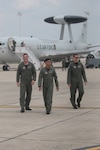Second Lts. Benjamin Smith, Jason Utulo and David Castillo, 562nd Flying Training Squadron, walk away after exploring an E-3 Sentry, or AWACS, an airborne surveillance, command, control and communication aircraft, on Command Day May 5. Command Day features a series of presentations, briefings and displays that allow combat systems operator students an opportunity to talk with instructors about different airframes, operations, and the base facilities and quality-of-life issues that would accompany the assignment the students choose to take. (U.S. Air Force photo by Steve White)