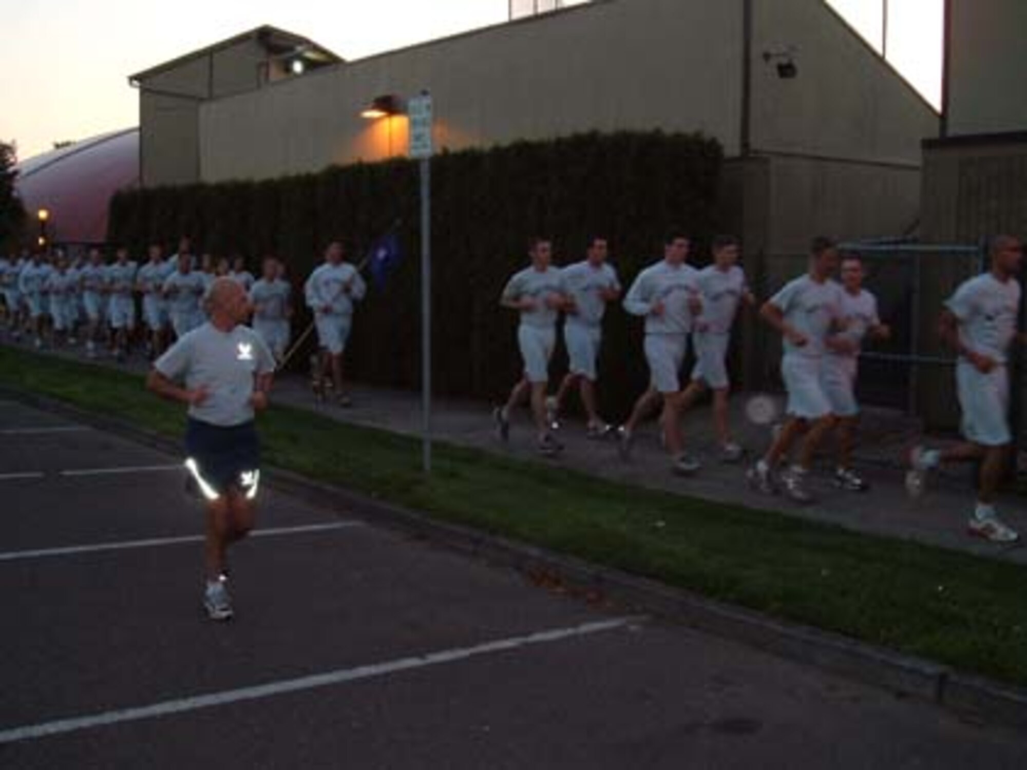 Master Sgt. Mike Sanders (left) running with Air Force Reserve Officer Training Corps cadets at the University of Portland in 2007.  Sergeant Sanders was part of a test program using senior non-commissioned officers as AFROTC instructors when he was diagnosed with cancer.  (Photo courtesy Master Sgt. Mike Sanders) 