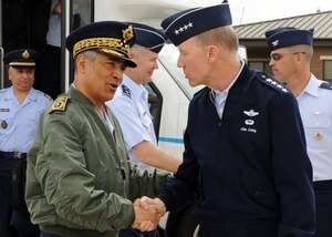 LANGLEY AIR FORCE BASE Va. -- Gen. John D. W. Corley, Air Combat Command commander, greets Maj. Gen. Ahmed Boutaleb, Inspector of Royal Moroccan Air Forces, on his arrival here May 4. General Boutaleb received a tour of Langley, an F-22 Raptor, F-15 Eagle static display, and the 480th Intelligence, Surveillance and Reconnaissance Wing. (U.S.Air Force photo/Airman 1st Class Jonathan Koob)