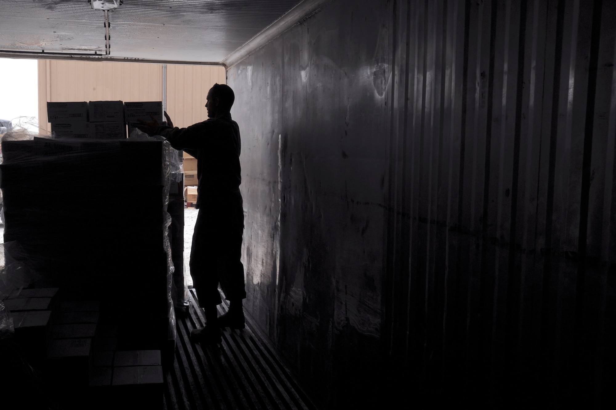 Senior Airman Bickford, a rations clerk with the 379th Expeditionary Force Support Squadron, reorganizes a storage container to make more room, May 6, 2009, in an undisclosed location in Southwest Asia. Each storage container is organized by different types of food, making it easier to locate and retrieve items as needed. Airman Bickford is native to Lafargeville, N.Y. and is deployed from Nellis Air Force Base, Nev., in support of Operations Iraqi and Enduring Freedom and Combined Joint Task Force - Horn of Africa.  (U.S. Air Force Photo by Staff Sgt. Joshua Garcia/released)