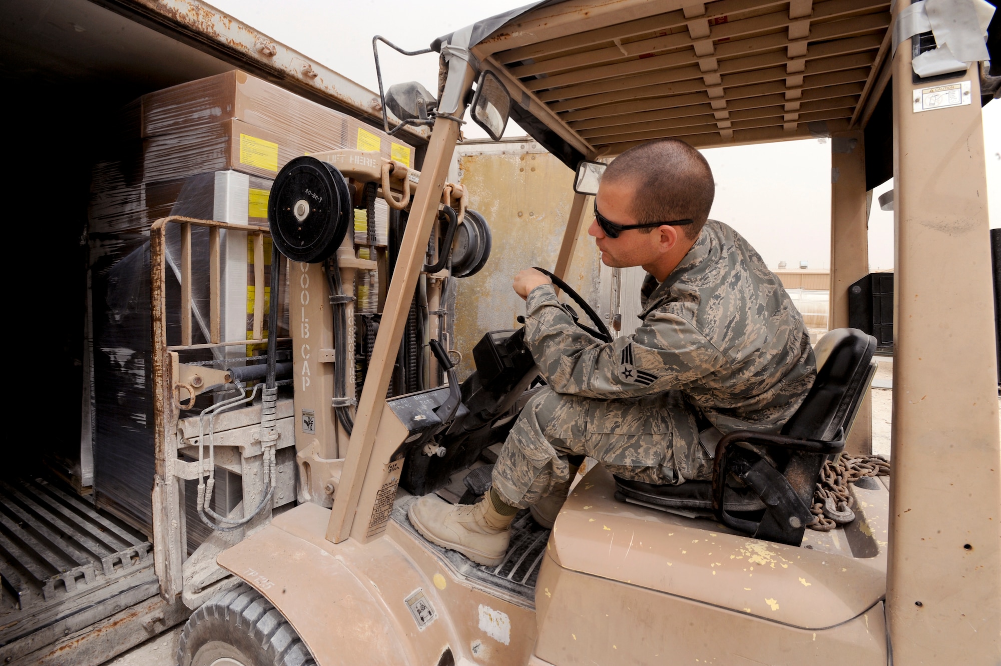 Senior Airman Daniel Bickford, a rations clerk with the 379th Expeditionary Force Support Squadron, loads a pallet of frozen food into a cold storage container to hold until it is needed, May 6, 2009, in an undisclosed location in Southwest Asia.  Airman Bickford and fellow rations clerks process over 81,000lbs of food every week.  Airman Bickford hails from Lafargeville N.Y. and is deployed from Nellis Air Force Base, Nev., in support of Operations Iraqi and Enduring Freedom and Combined Joint Task Force - Horn of Africa.  (U.S. Air Force Photo by Staff Sgt. Joshua Garcia/released)