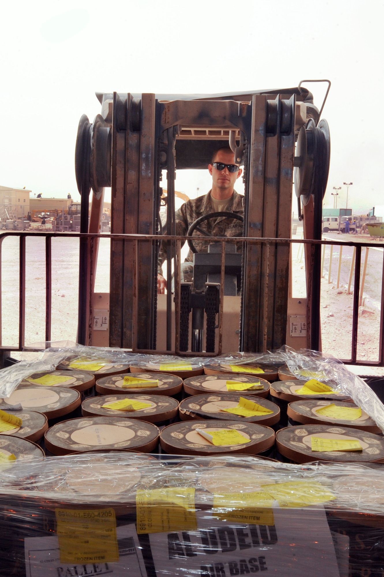 Senior Airman Daniel Bickford, a rations clerk with the 379th Expeditionary Force Support Squadron, transfers ice cream to a cold storage container to be held until it's needed, May 6, 2009, in an undisclosed location in Southwest Asia.  Airman Bickford and fellow rations clerks process over 81,000lbs of food every week.  Airman Bickford hails from Lafargeville, N.Y., and is deployed from Nellis Air Force Base, Nev., in support of Operations Iraqi and Enduring Freedom and Combined Joint Task Force - Horn of Africa.  (U.S. Air Force Photo by Staff Sgt. Joshua Garcia/released)
