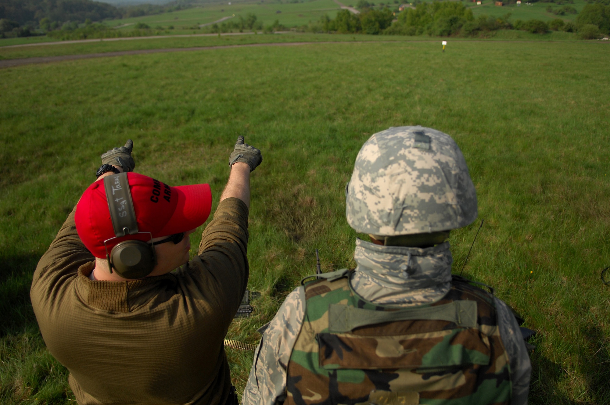United States Air Force Staff Sgt. Chris Treas, 569th United States Forces Police Squadron combat arms instructor, explains the range of fire to a security forces squadron member who is training for deployment, April 30, 2009, Baumholder, Germany. The 569th USFPS executes several different missions from installation security to weapons and deployment training. (U.S. Air Force photo by Senior Airman Kenny Holston)