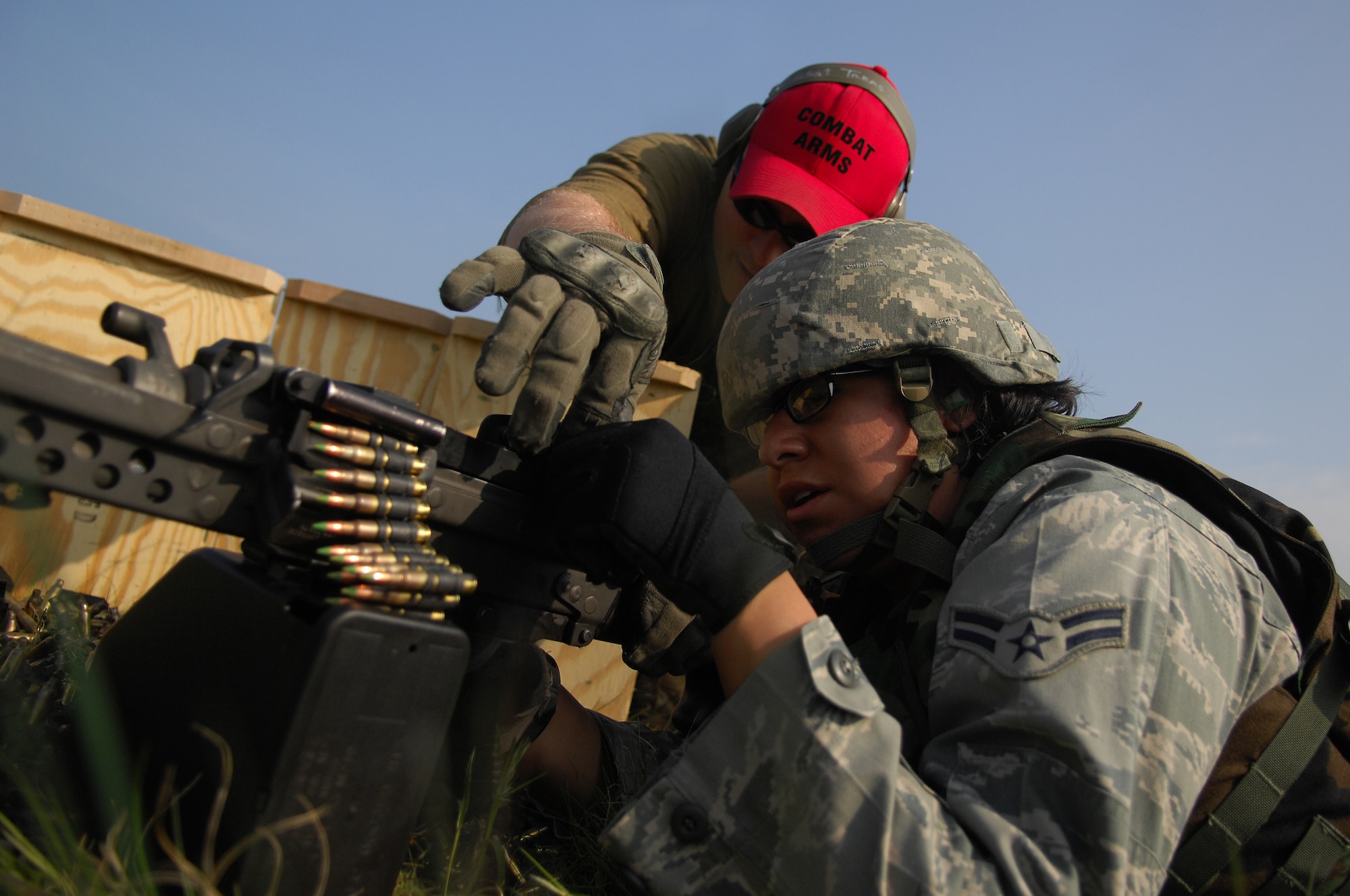 United States Air Force Staff Sgt. Chris Treas, 569th United States Forces Police Squadron weapons instructor, adjusts rounds for a security forces member training for deployment, April 30, 2009, Baumholder, Germany. The 569th USFPS executes several different missions from installation security to weapons and deployment training.(U.S. Air Force photo by Senior Airman Kenny Holston)