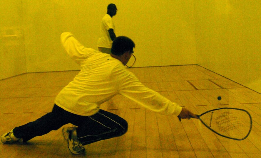 YOKOTA AIR BASE, Japan -- James DeThomas, 730th Air Mobility Squadron, reaches for a shot against Lloyd Jack, U.S. Forces Japan, during the base intramural racquetball championship May 8 at the Samurai Fitness Center. The USFJ team won their second straight championship in the nine-team league. Other championship team members include: Randy Higuchi, Dave Huntington, Dale Sonnenberg and Dave Wendling. Other members of the second-place squad include: Rob Ducharme, Edward Garcia, Adam Justice, Al McKenna, Jeff Medina, Jason Morgan and Dan Overton. (U.S. Air Force photo/Master Sgt. Matt Summers)