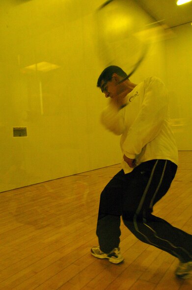 YOKOTA AIR BASE, Japan -- James DeThomas, 730th Air Mobility Squadron, prepares to return a shot May 8 in a match against Lloyd Jack, U.S. Forces Japan, during the base intramural racquetball championship at the Samurai Fitness Center. The USFJ team won their second straight championship in the nine-team league. Other championship team members include: Randy Higuchi, Dave Huntington, Dale Sonnenberg and Dave Wendling. Other members of the second-place squad include: Rob Ducharme, Edward Garcia, Adam Justice, Al McKenna, Jeff Medina, Jason Morgan and Dan Overton. (U.S. Air Force photo/Master Sgt. Matt Summers)