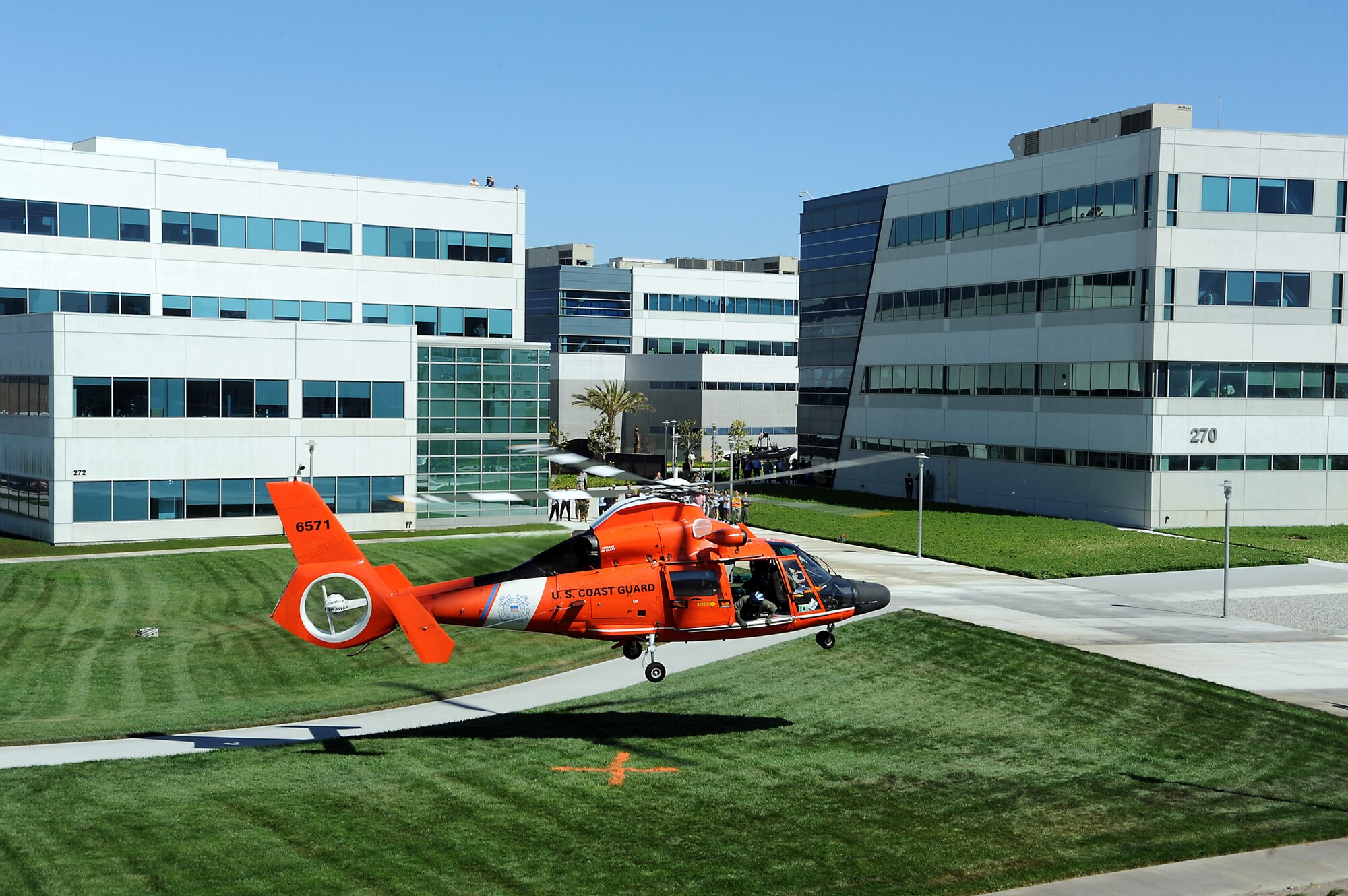 A Coast Guard search and rescue helicopter lands on Los Angeles Air Force Base, May 6.  It was on display during the GPS Wing’s annual Partnership Council to demonstrate the use of GPS technology. (Photo by Joe Juarez)