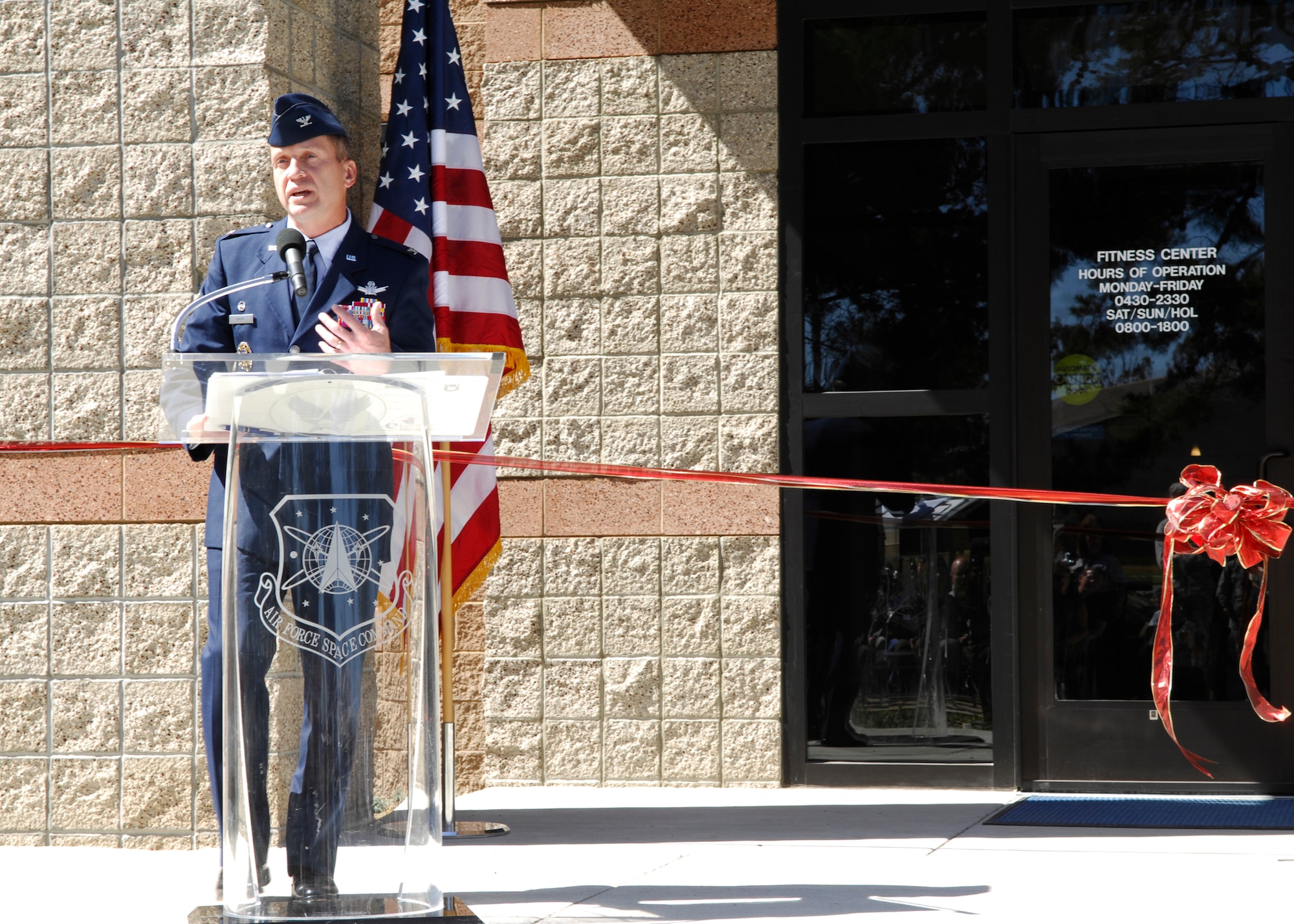 VANDENBERG AIR FORCE BASE, Calif. -- Applauding the hard work that made the fitness center here a reality, Col. David Buck, the 30th Space Wing commander, speaks to Team V during the official ribbon cutting ceremony May 8. Following the ceremony, the fitness center was officially opened for business. (U.S. Air Force photo/Airman 1st Class Heather Shaw)