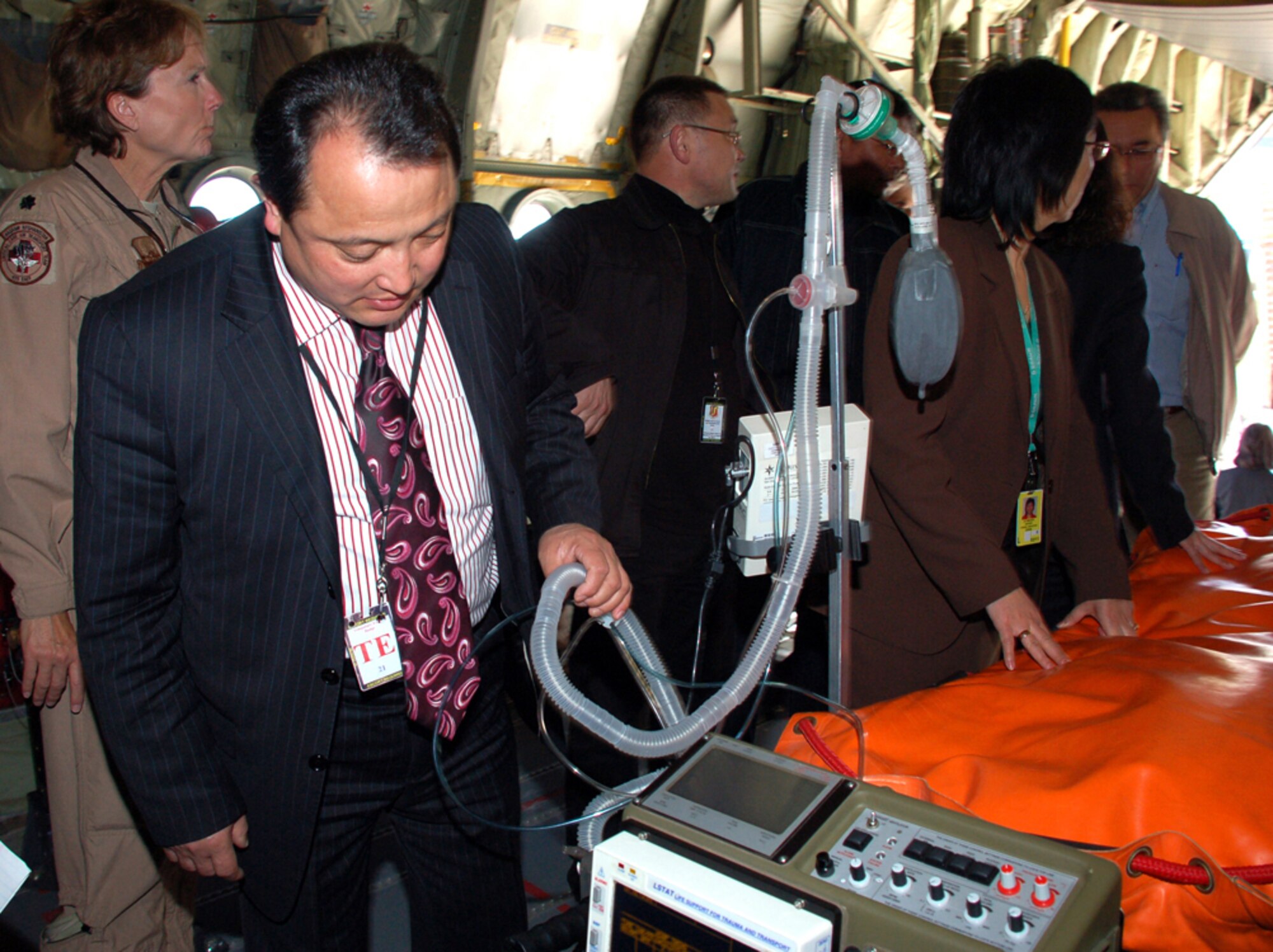 Dr. Sabyrbek Djumabekov examines medical equipment housed on a Spanish C-130 aeromedical evacuation plane during the 376th Expeditionary Medical Group's recent coalition medical symposium at Manas Air Base, Kyrgyzstan.  Doctor Djumabekov is director of the Bishkek Scientific Research Center of Trauma and Orthopedics. He and his colleagues, along with Spanish coalition medical staff, U.S. Embassy medical unit personnel and Peace Corps medical staff were guests of the symposium hosted by 376th EMDG. (U.S. Air Force photo/Tech. Sgt. Phyllis Hanson)