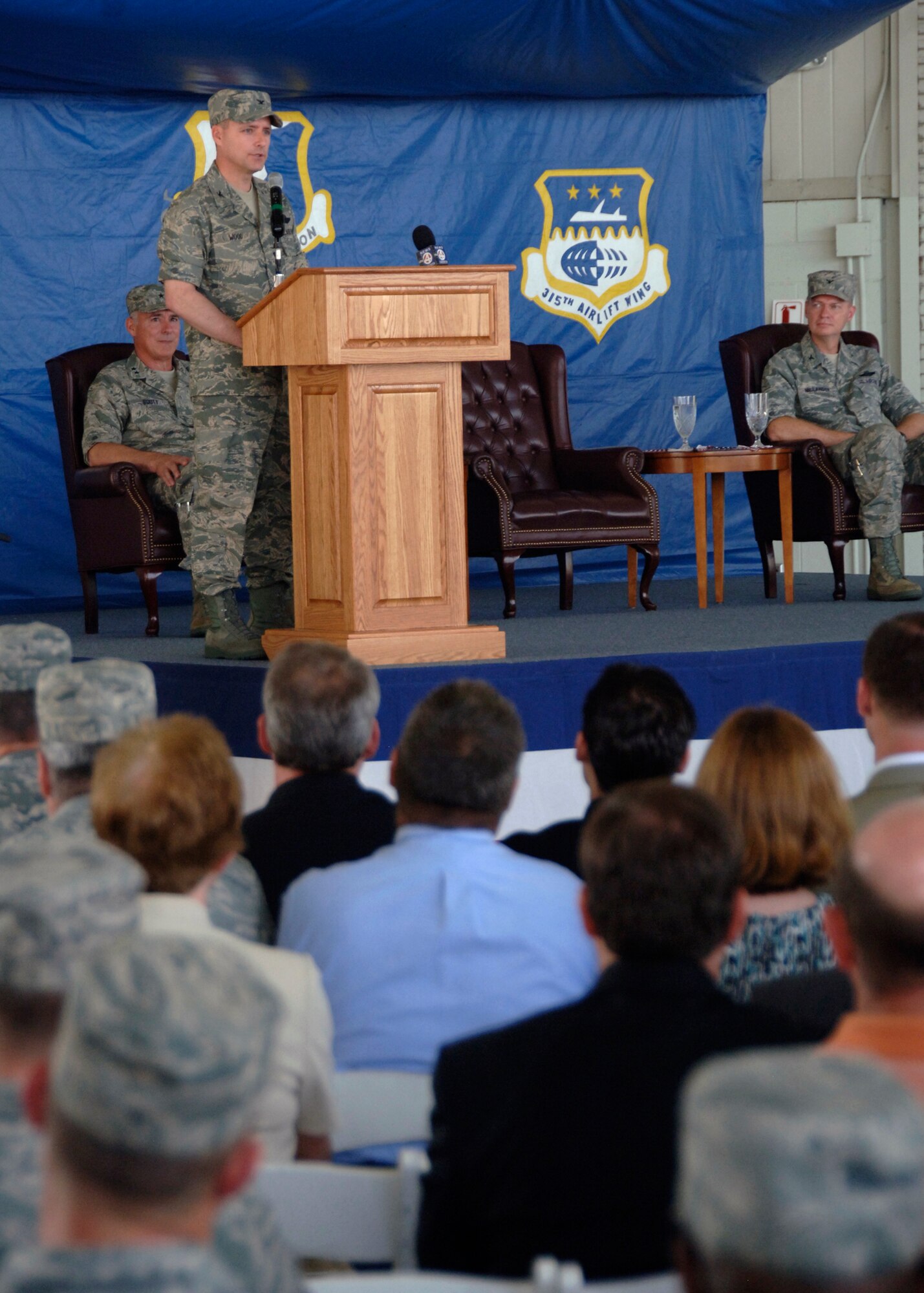 Col. John Wood speaks before military and community members for the first time as commander of the 437th Airlift Wing at Charleston Air Force Base May 8. Colonel Wood promised to bring his legacy of service to family, faith and country to Charleston AFB, its Airmen and the local community. (U.S. Air Force photo/Senior Airman Timothy Taylor)
