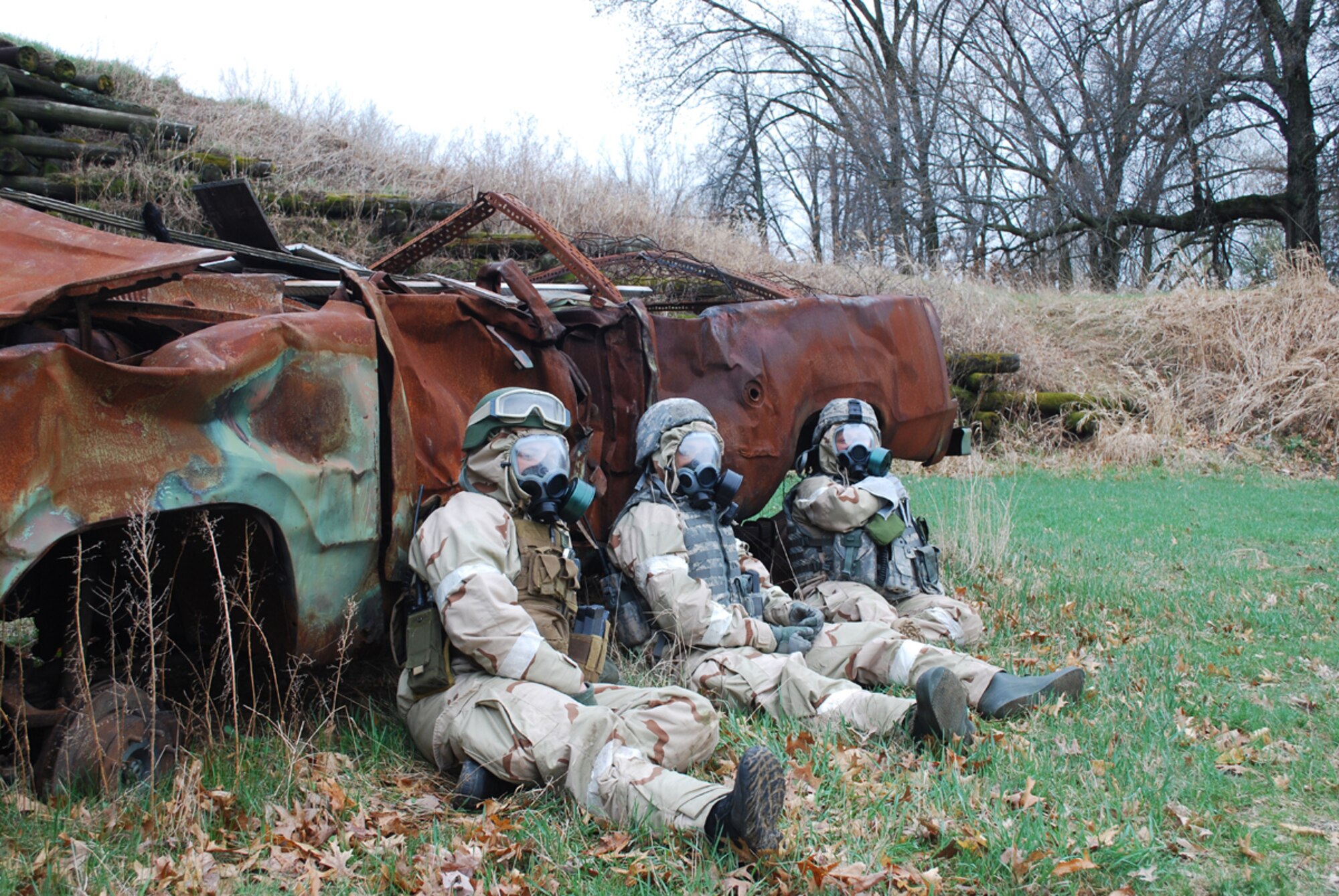 Airmen from the 621st Contingency Response Wing take cover from a simulated chemical missile attack during an Operational Readiness Exercise at Volk Field, Wisc., April 22-30. (U.S. Air Force photo/Staff Sgt. Nicholas Phelps)