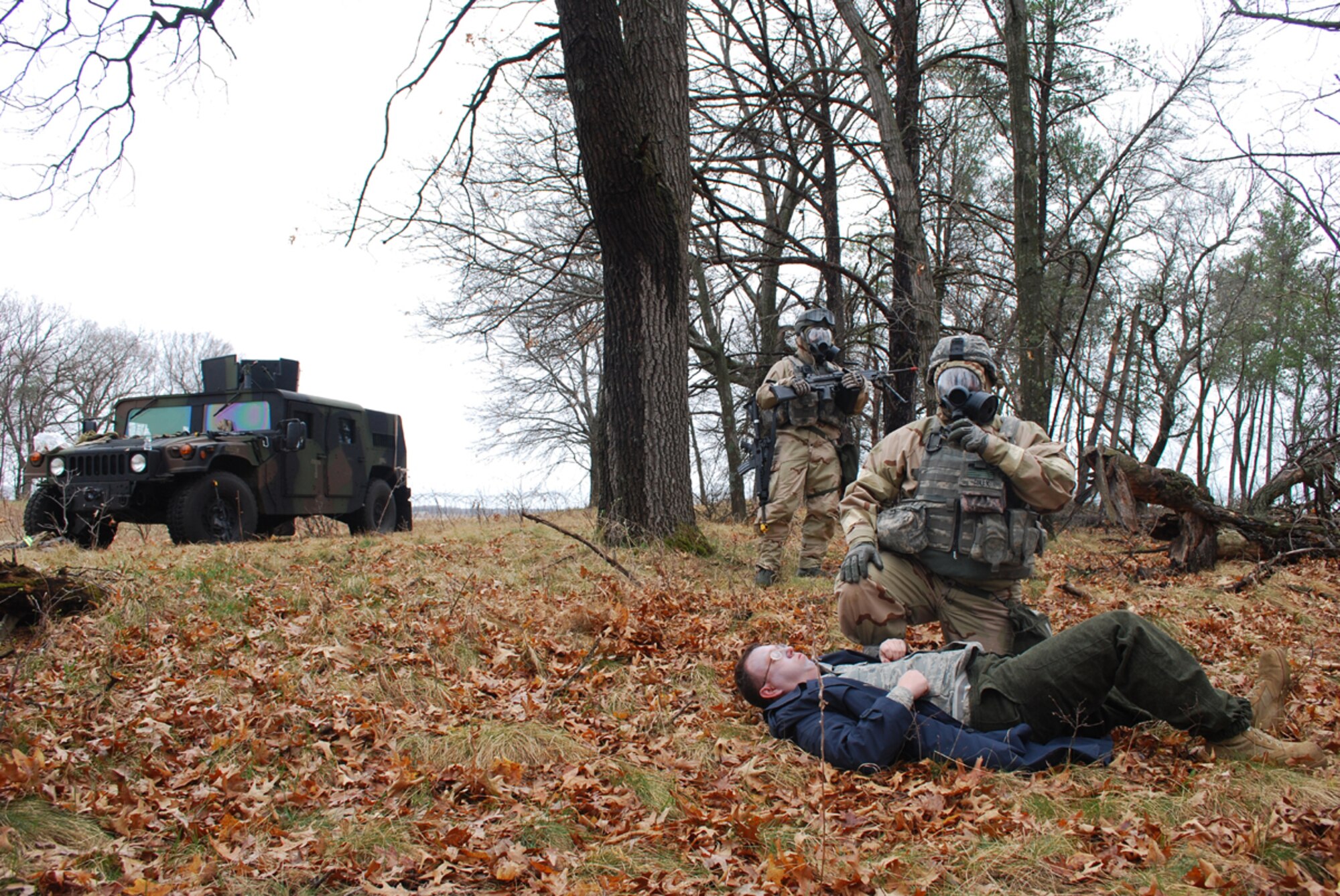 An Airman from the 818th Contingency Response Group calls in medical support for a simulated victim of a nerve agent during an Operational Readiness Exercise held at Volk Field, Wisc., April 22-30. The ORE tested the Contingency Response Wing's ability to rapidly deploy to and operate in an environment with a high chemical, biological, radiological, nuclear and explosive threat. (U.S. Air Force photo/Staff Sgt. Nicholas Phelps)