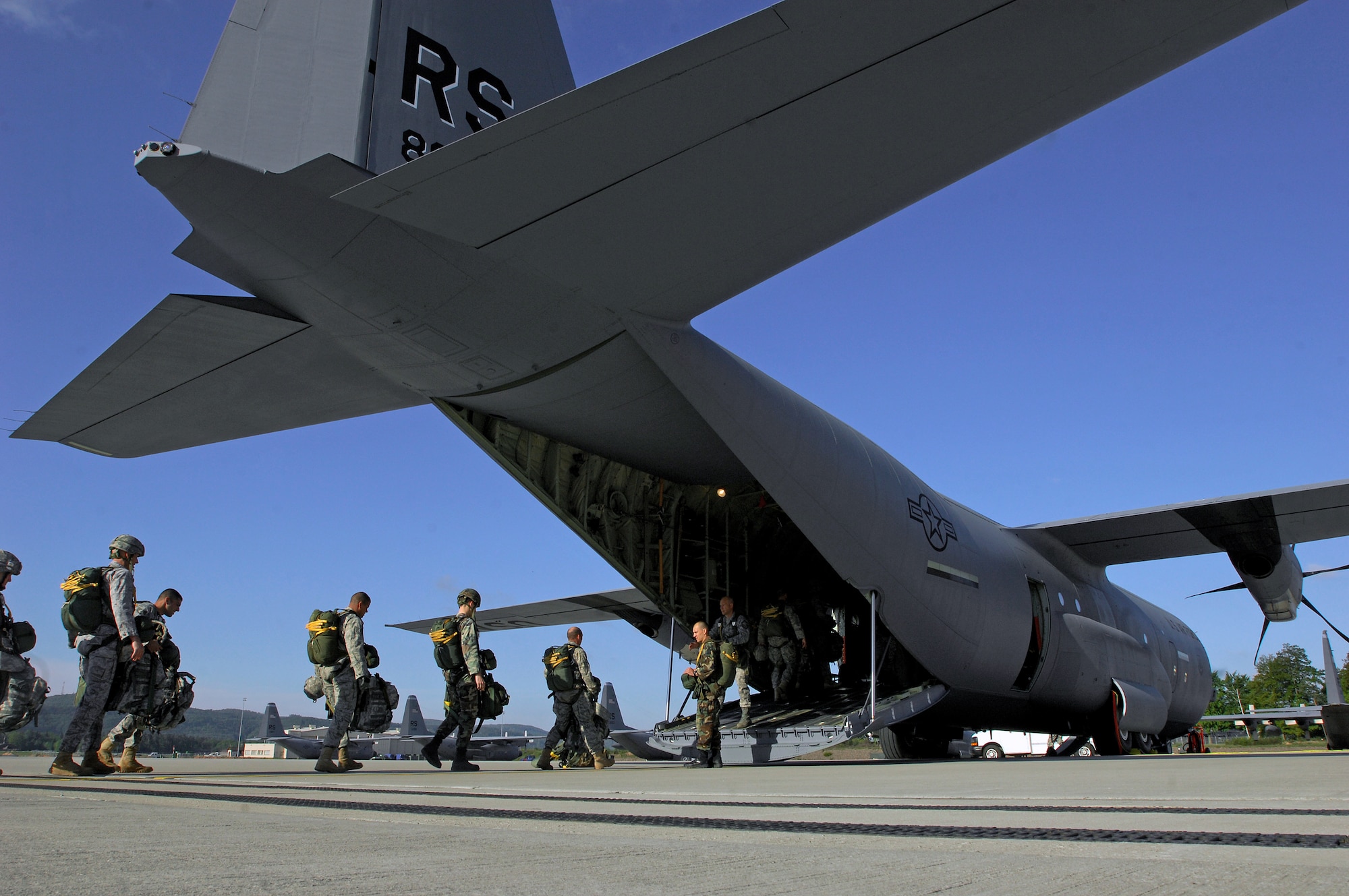 Airmen and Army paratroopers load into a new C-130J Super Hercules for the first personnel drop from Ramstein Air Base, Germany. (U.S. Air Force photo/Senior Airman Kenny Holston) 
