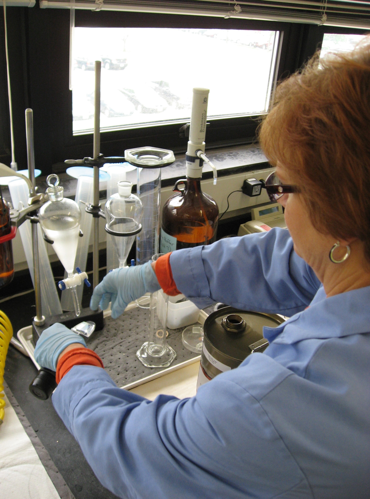 Janet Stewart tests for the concentration of fuel system icing inhibitor in a sample of commercial Jet A fuel in the Aerospace Fuels Laboratory at Wright-Patterson Air Force Base, Ohio. The Air Force Petroleum Agency and Air Force Research Laboratory researchers are partnering on an initiative to evaluate the use of commercial jet fuel in place of military standard JP-8 fuel. Ms. Stewart is a fuels quality assurance specialist with the Aerospace Fuels Laboratory at Wright-Patterson Air Force Base, Ohio. (U.S. Air Force photo/Derek Kaufman)