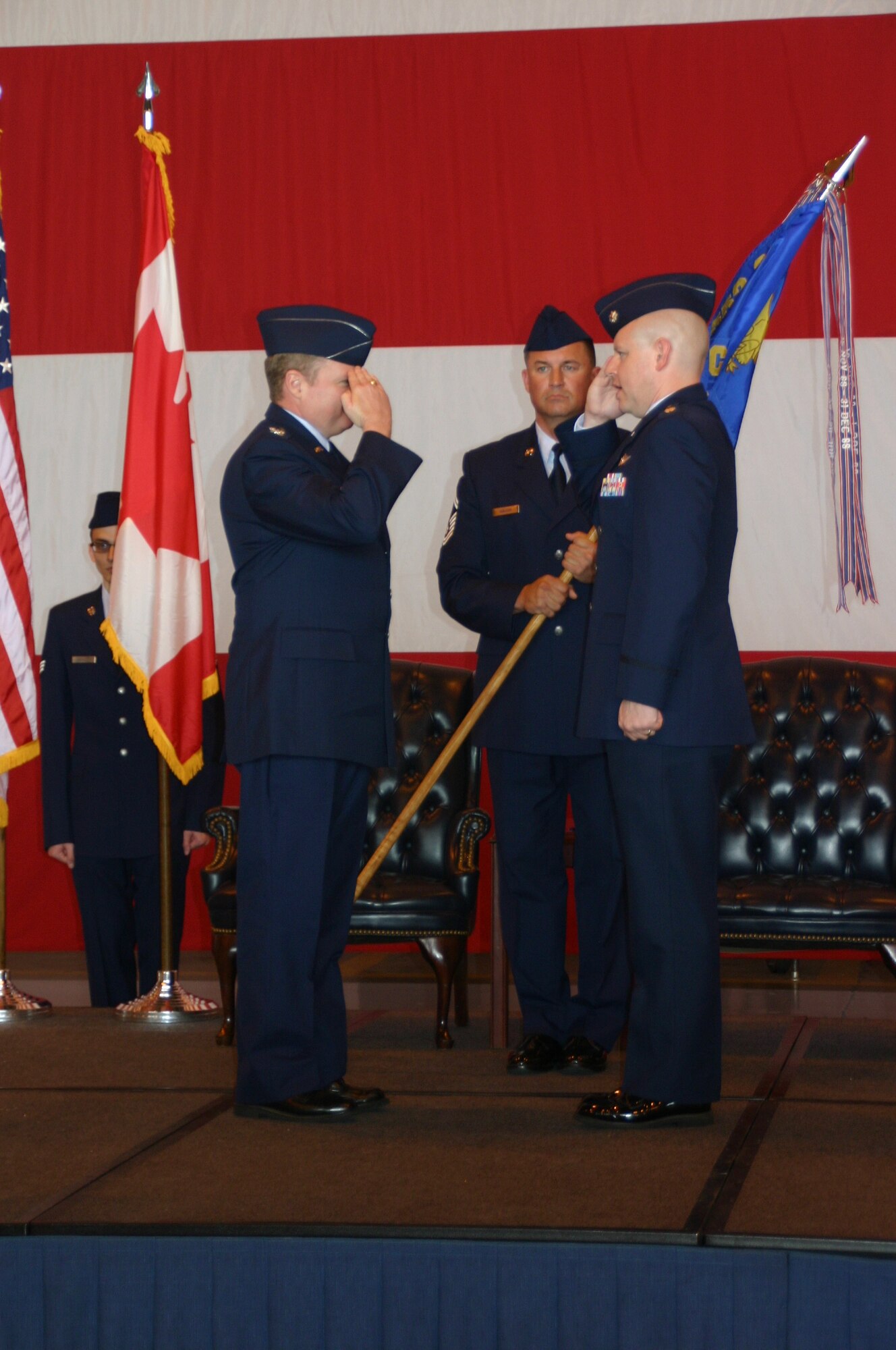 Lieutenant Col. Greg Kent salutes his new boss, Col. George Carpenter, commander, 552nd Operations Group, after taking command of the 966th Airborne Air Control Squadron. 