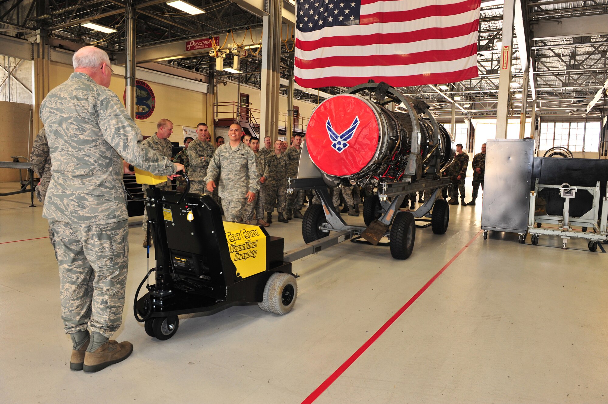 Shaw Air Force Base, S.C.- Lieutenant General Loren Reno, Deputy Chief of Staff for Logistics, learns from SSgt Jose Chavira, 20th Component Maintenance Squadron, on how to operate a cart caddy to pull an F-16 engine May 6, 2009.  LtGen Reno spent most of the day touring Shaw AFB, learning how each duty section was making improvements using AFSO 21 and hearing the thoughts of the Airmen who work at Shaw.  (U.S. Air Force Photo by Senior Airman William Coleman)