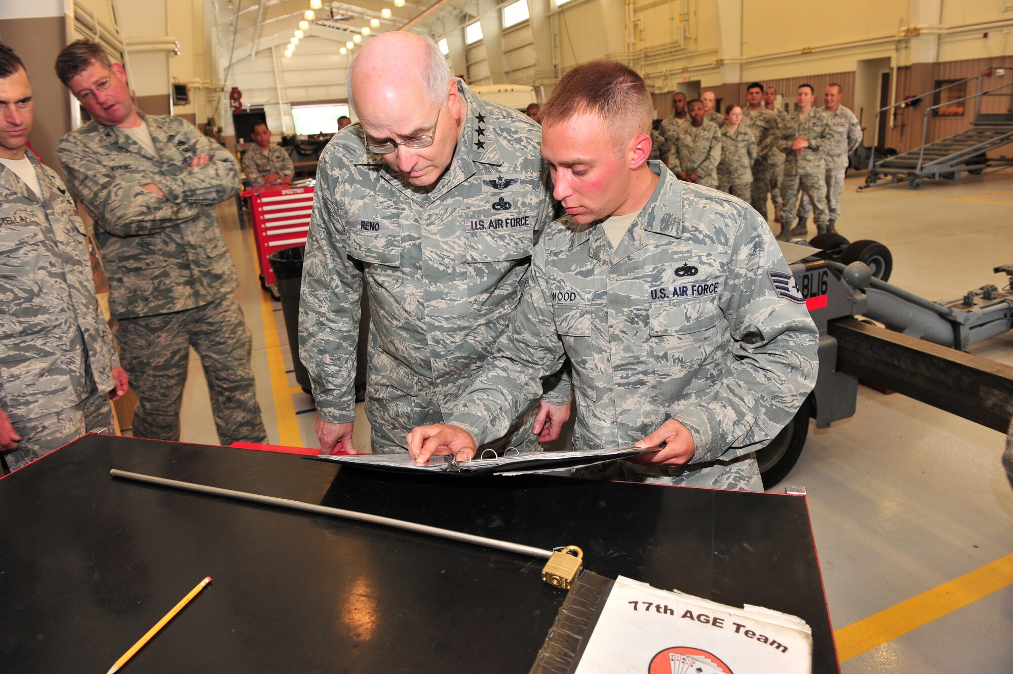 Shaw Air Force Base, S.C.- Lieutenant General Loren Reno, Deputy Chief of Staff for Logistics, looks at maintenance records with SSgt David Wood, 20th Equipment Maintenance Squadron, May 6, 2009.  LtGen Reno spent most of the day touring Shaw AFB, learning how each duty section was making improvements using AFSO 21 and hearing the thoughts of the Airmen who work at Shaw.  (U.S. Air Force Photo by Senior Airman William Coleman)