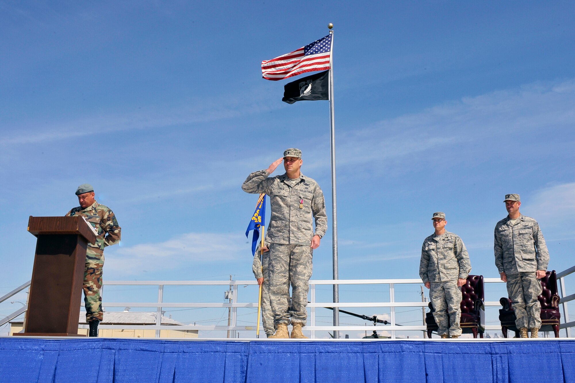 Lt. Col. Christopher Tacheny’s wife, Sandra, is given flowers by an Airman from the 336th Training Group during the 66th Training Squadron’s Change of Command Ceremony here May 1. Colonel Tacheny took command of the unit. (U.S. Air Force photo / Senior Airman Joshua K. Chapman)