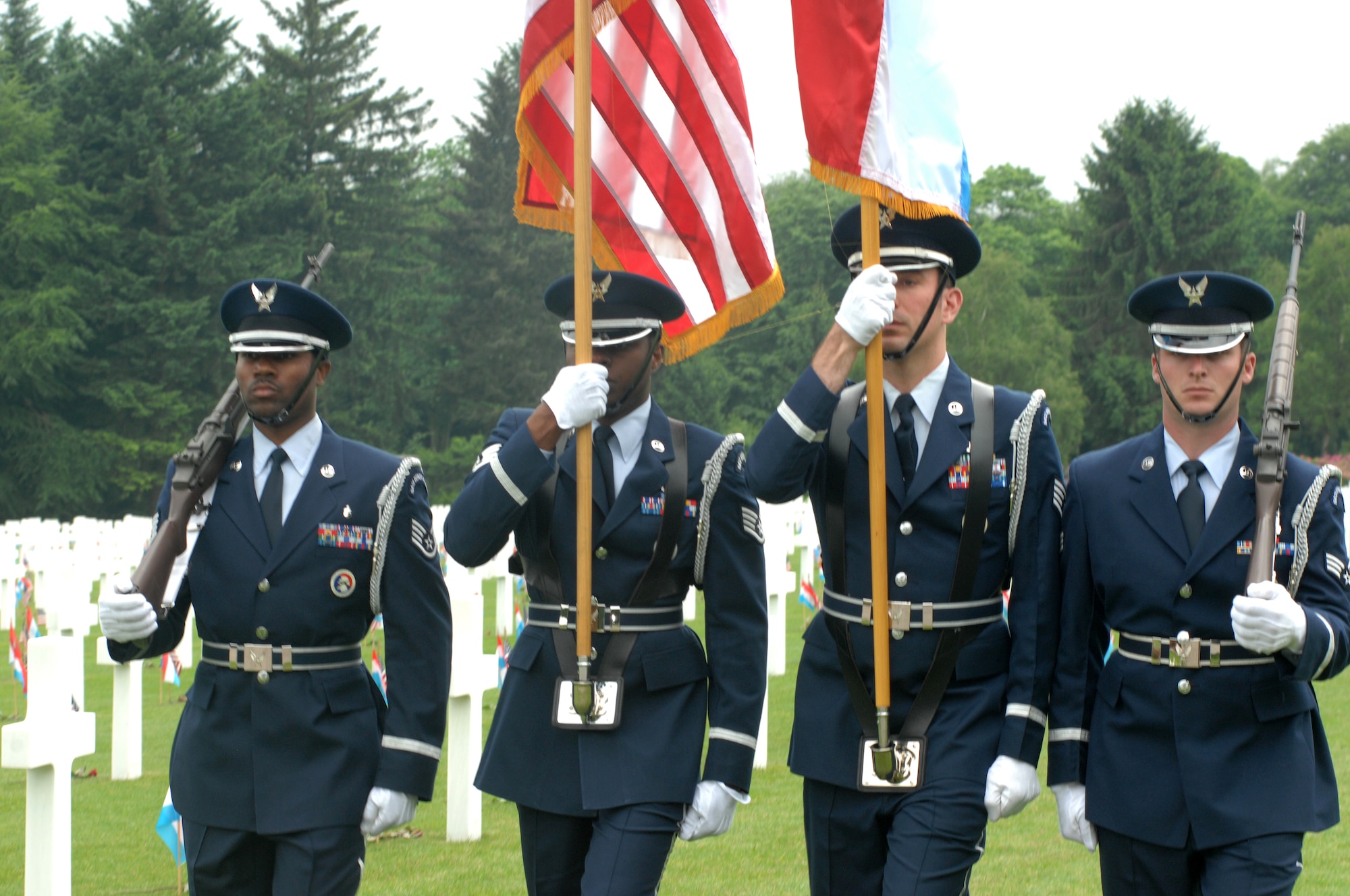 LUXEMBOURG CITY, Luxembourg – Airmen of the 52nd Fighter Wing Honor Guard present the colors during a Memorial Day ceremony at the Luxembourg American Cemetery and Memorial May 24, 2008. Many of the cemeteries in Belgium, the Netherlands and Luxembourg, where U.S. servicemembers are buried, have local nationals who have adopted the American graves. It is common for them to honor the fallen servicemembers on Memorial Day by decorating the graves as an expression of appreciation for their freedom and the sacrifices made by Americans on their behalf. (U.S. Air Force photo by Staff Sgt. Logan Tuttle)
