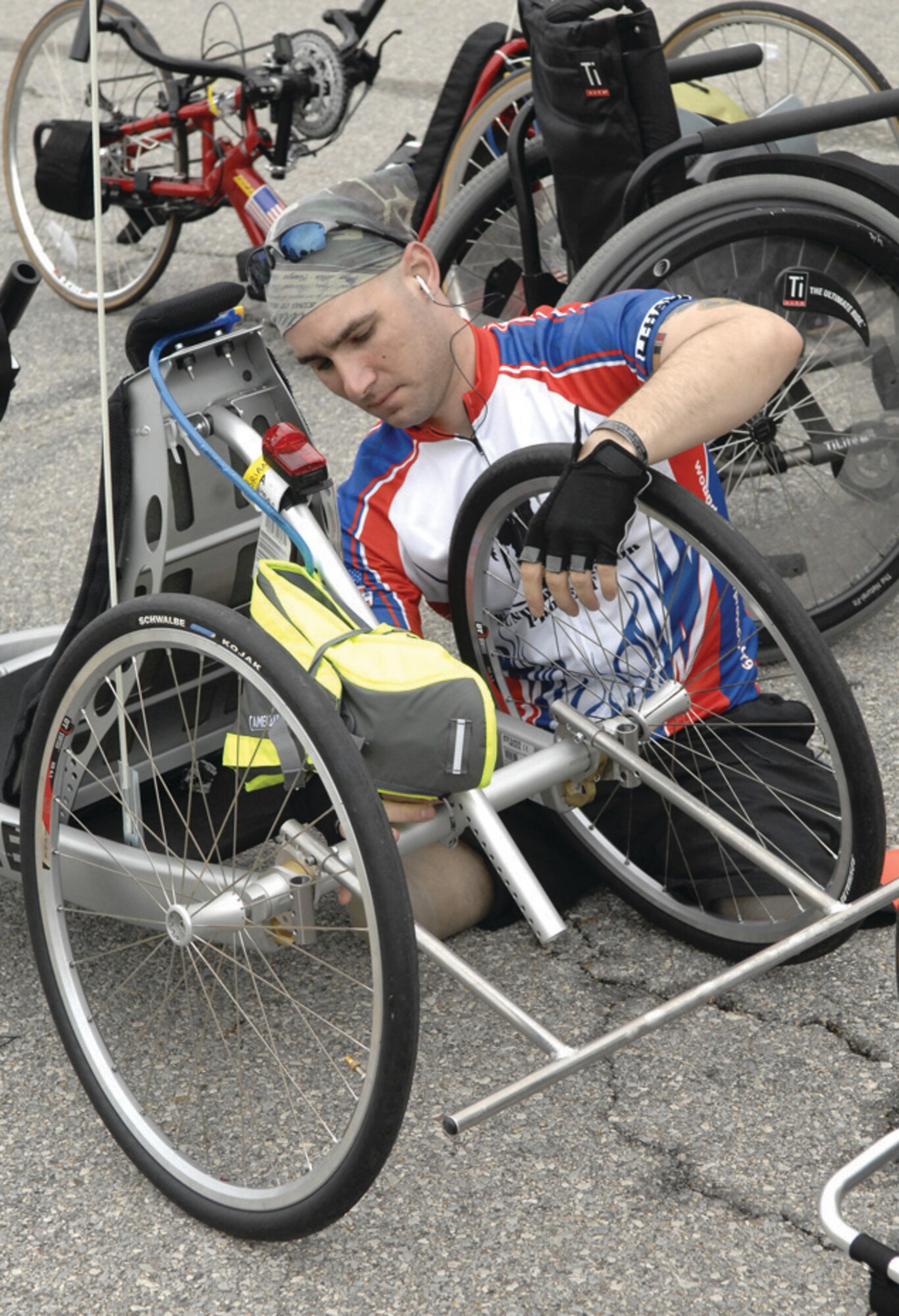 Sergeant Brian Schar, a Combat Engineer from the 1st Army Infantry Division, prepares his bicycle for the ride from Andrews to Annapolis. (U.S. Air Force photo/ Senior Airman Giang Nguyen)