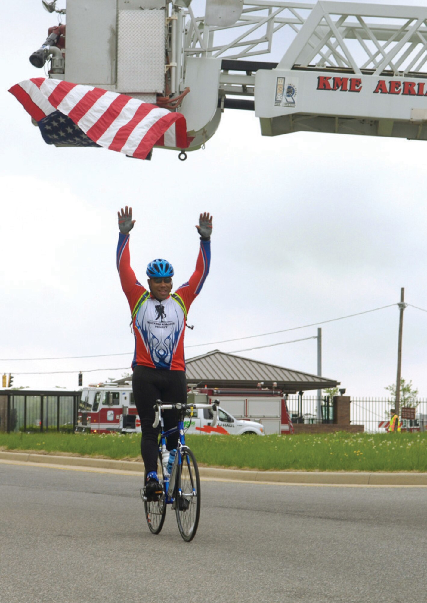A participant in the Soldier Ride cycles through the North Gate as they exit Andrews. (U.S. Air Force photo/ Senior Airman Renae Kleckner)