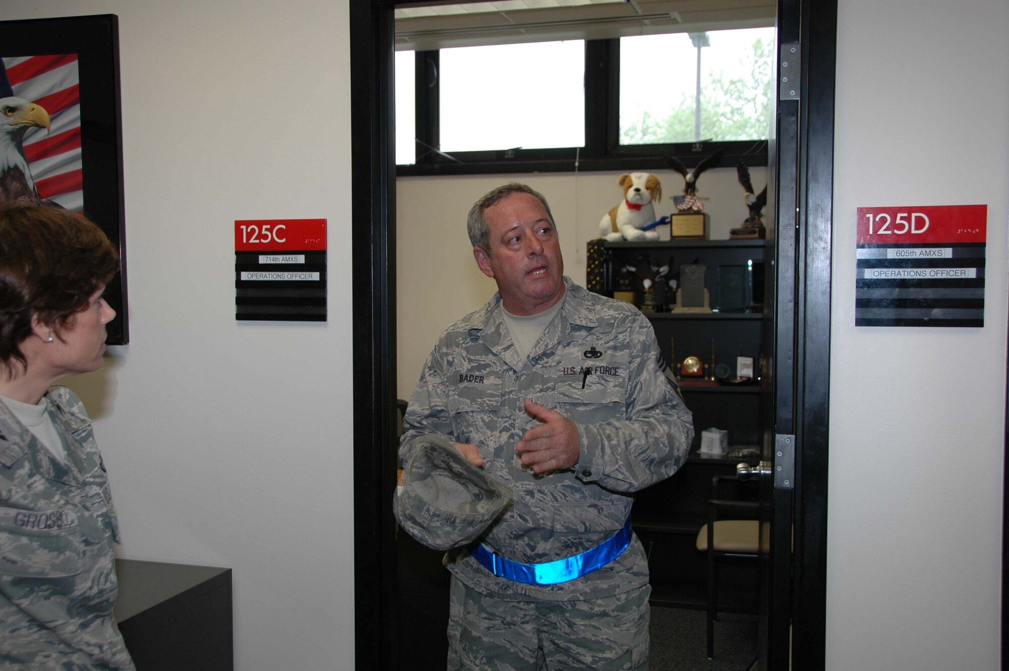 MCGUIRE AIR FORCE BASE, N.J. -- Chief Master Sgt. Lane Bader, maintenance superintendent for the 714th Aircraft Maintenance Squadron explains the layout of the KC-10 Combined Maintenance and Operation Facility. The newly renovated facility was officially opened May 7 with a ribbon cutting ceremony held here. All  Reserve and active duty maintenance members now operate from the same buildings sharing the same office space. (U.S. Air Force photo/Master Sgt. Donna T. Jeffries) 