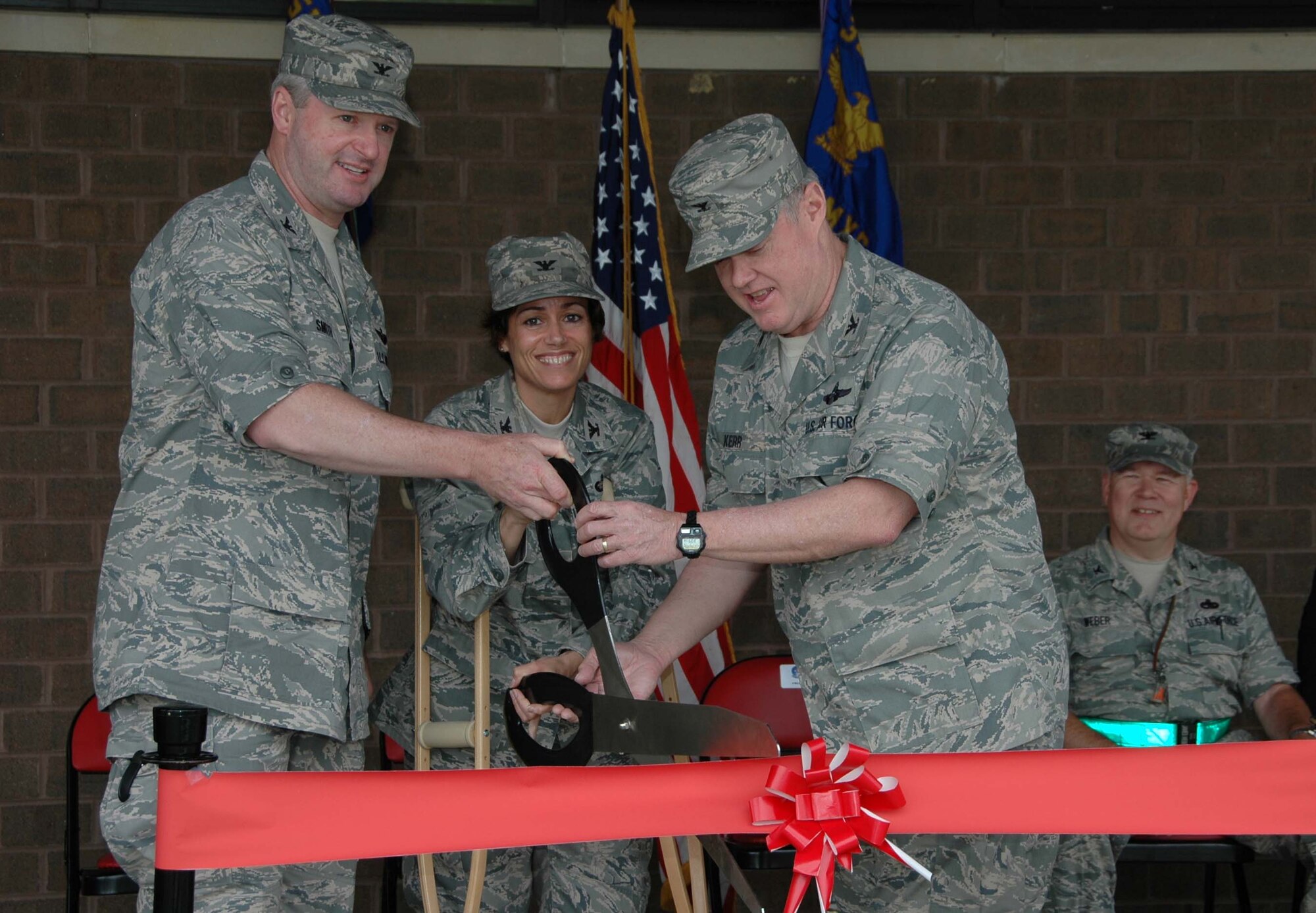 MCGUIRE AIR FORCE BASE, N.J. -- Reserve and Active duty wing commanders on Joint Base McGuire-Dix-Lakehurst officially open the renovated KC-10 Combined Maintenance and Operation Facility May 7 with a ribbon cutting ceremony held here. Tanker maintenance members from both wings will now operate from the same building sharing the same office space. (U.S. Air Force photo/Master Sgt. Donna T. Jeffries) 