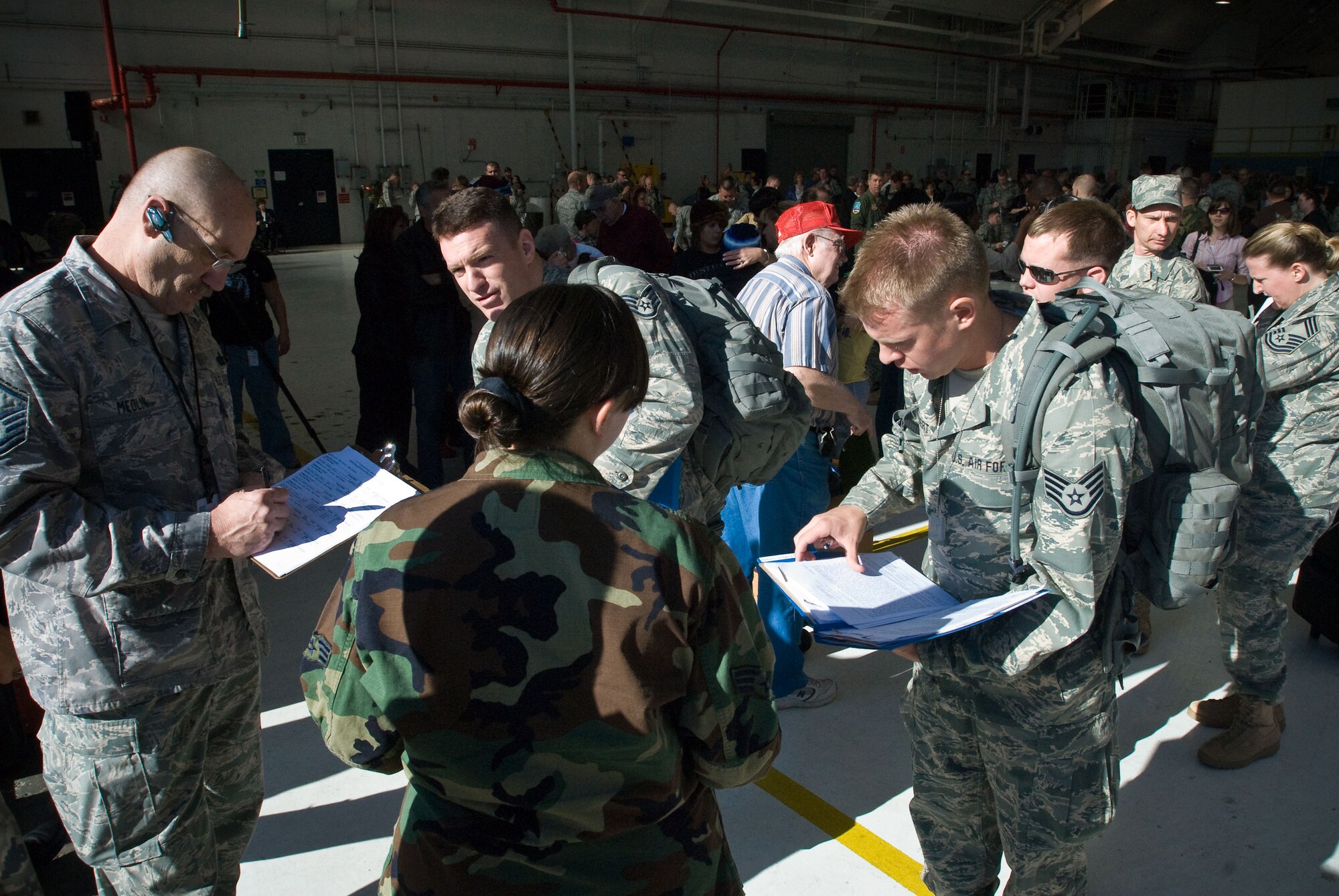 Colorado Air National Guardsmen from Buckley Air Force Base, Aurora, CO, verify their paperwork is in order before departing for Iraq. More than 200 Airman volunteered to deploy to Iraq in support of Operation Iraqi Freedom. (U.S. Air Force photo/Master Sgt. John Nimmo, Sr.) (RELEASED)