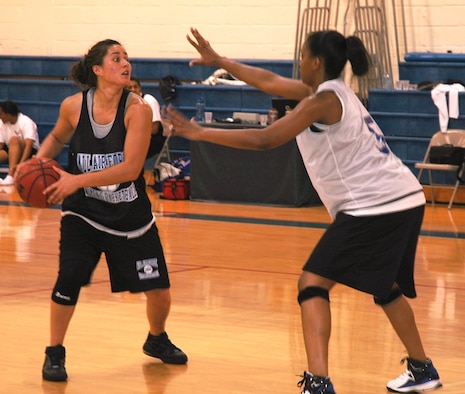 2nd Lt. Andrea Taylor tries to get past Senior Airman Richere Harrison during practice for the Air Force Women's Basketball Team at the Patrick Fitness Center April 30. (U.S. Air Force photo/Tech. Sgt. Lisa Luse)