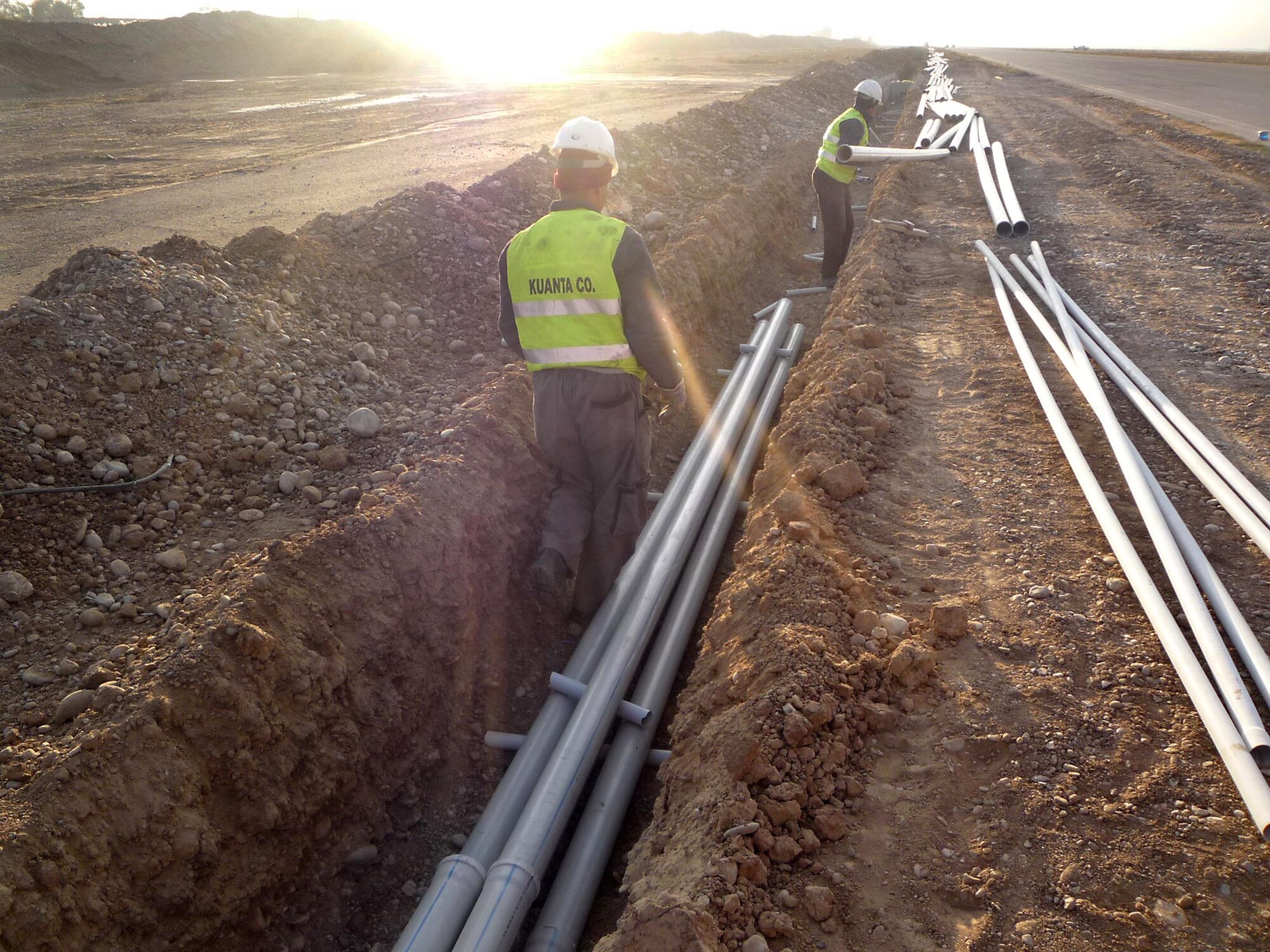 Contractors install conduit lines at Kirkuk Regional Air Base, Iraq, as part of a foreign military sales effort being managed by the Electronic Systems Center’s 853rd Electronic Systems Group.  (Courtesy photo)
