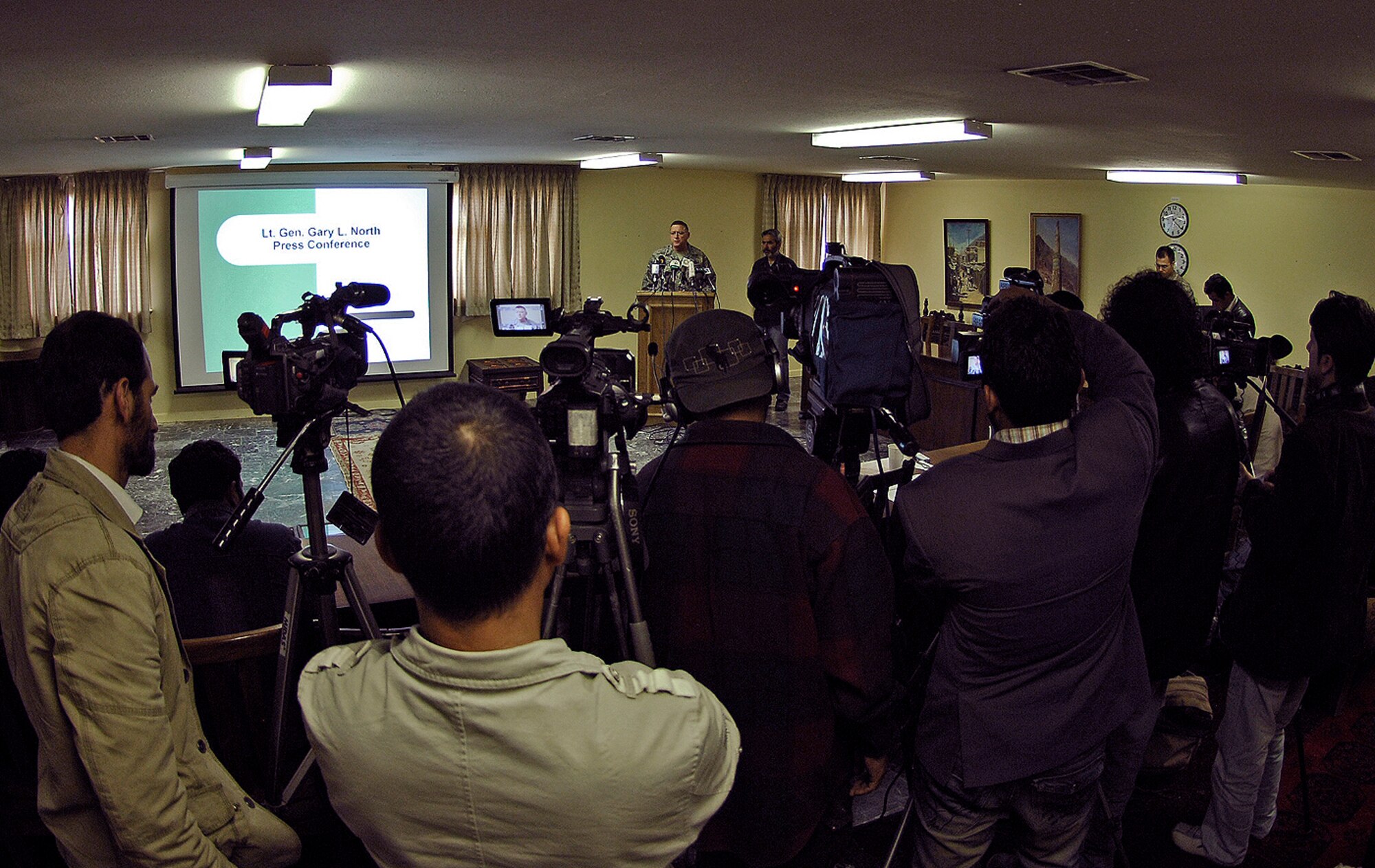 Lt. Gen. Gary North, Combined Forces Air Component commander for Southwest Asia, answers questions from Afghan media at his news conference during "Bagram Media Days" April 19. During his presentation, General North stressed the significant efforts made to reduce the risk to non-combatants during combat air operations in Afghanistan. (Air Force/Staff Sgt. Jason Lake)