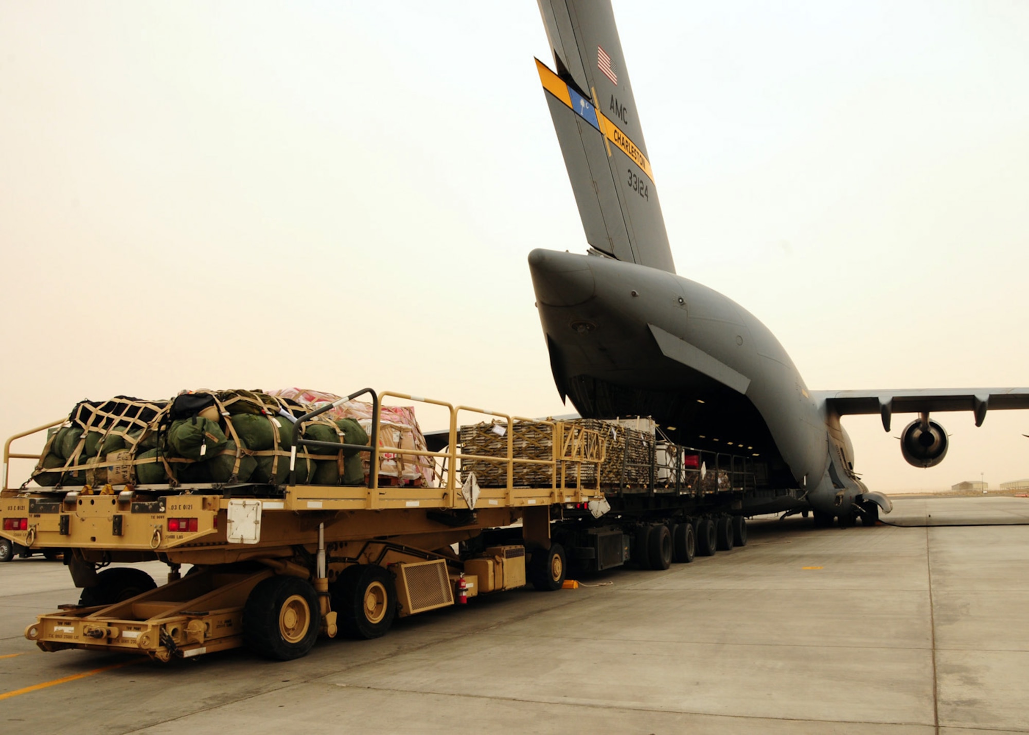 SOUTHWEST ASIA -- Cargo unloads from a C-17 Globemaster at an air base in Southwest Asia, May 6. Within an hour, this aircraft was loaded with new cargo and sent to Afghanistan. (U.S. Air Force photo/ Senior Airman Courtney Richardson)