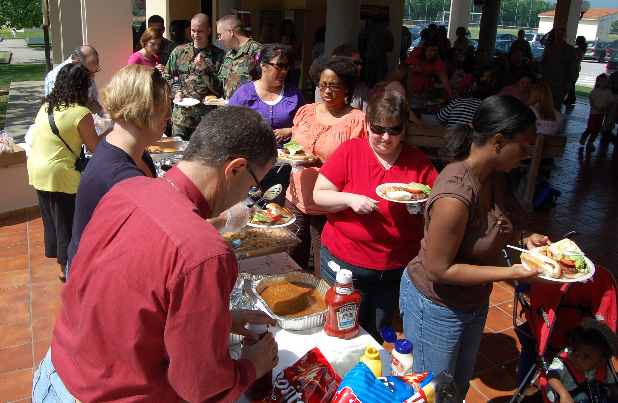 Aviano Airman and Family Readiness Center staff members serve base volunteers during the annual Aviano Volunteer Regocnition Ceremony May 7, 2009 in Area D. The base's 2,469 volunteers donated more than 22,225 hours of their time last year valued at about $401,180. (U.S. Air Force photo/Staff Sgt. Lindsey Maurice)