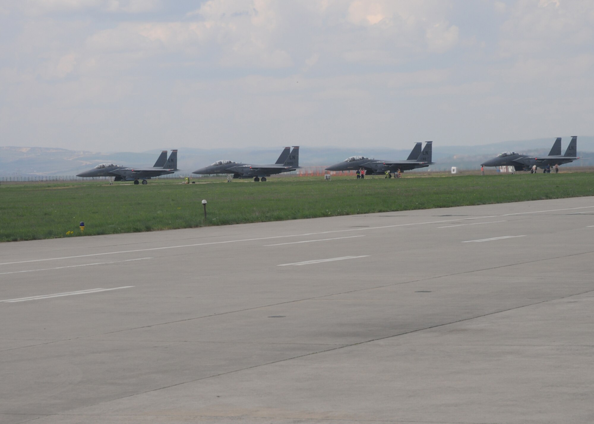 CAMPIA TURZII, Romania -- F-15E Strike Eagles from the 494th Fighter Squadron standby on the Campia Turzii flightline April 21, 2009. The 494th FS was participating in Strike Lance 09, an exercise between the U.S. Air Force and the Romanian Air Force. The exercise took place April 17 to 30. (U.S. Air Force photo by Senior Airman Kristopher Levasseur)