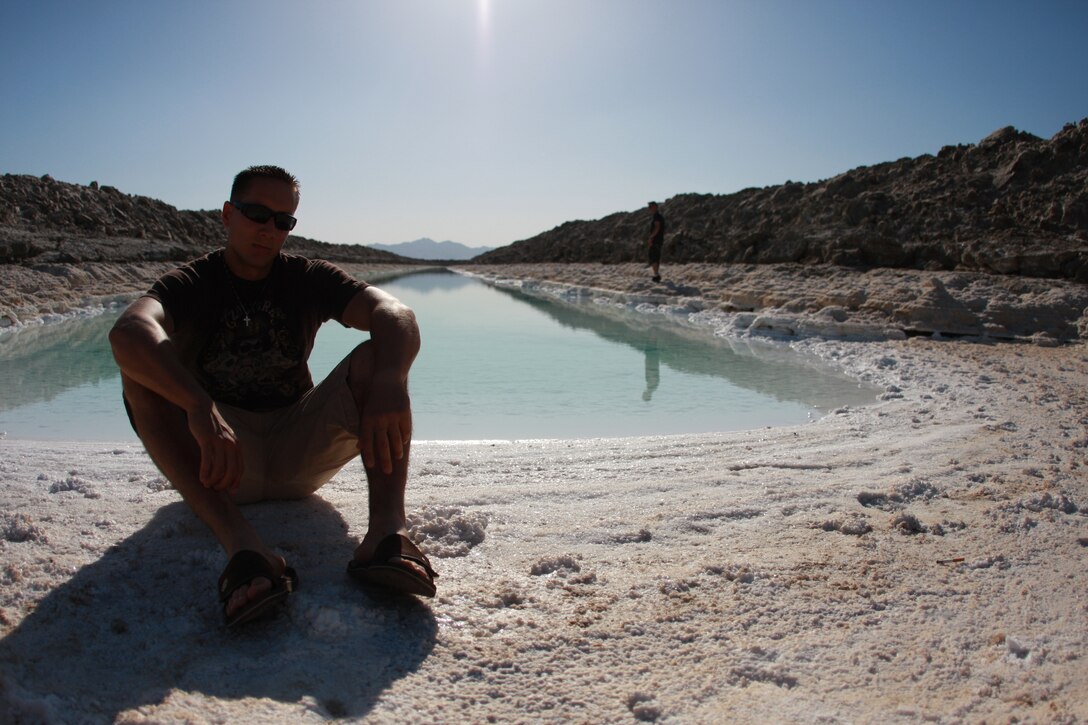 Lance Cpl. Aaron Kristopik, a paralegal clerk with the Combat Center’s Staff Judge Advocate and a native of New Britain, Conn., sits and takes in some sun May 9 at the Salt Evaporation Plan with their famous clear water off of Amboy Road.