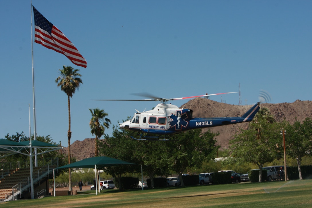 A Mercy Air helicopter lands before an aerial tour of the base for members of the Subcommittee on Energy and Mineral Resources at the Combat Center’s Lance Cpl. Torrey L. Gray Field Sunday.