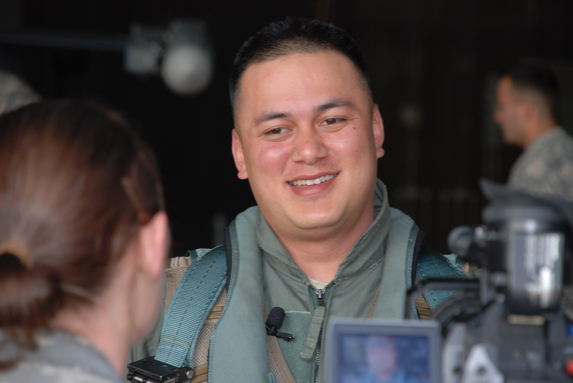 Army SGT Carl Matagolai, 3-2 Arial Defense Artillery D-32, smiles during an Armed Forces Network interview prior to his flight in a 13th Expeditionary Fighter Squadron (Deployed) F-16D.  SGT Matagolai was rewarded with a first-ever joint incentive flight at Suwon AB, ROK after being named 3-2 ADA Battalion NCO of the Quarter.  The 13th EFS is deployed to Suwon from the 35 FW, Misawa AB, Japan.  (USAF Photo/MSgt Lynn Rooker)

