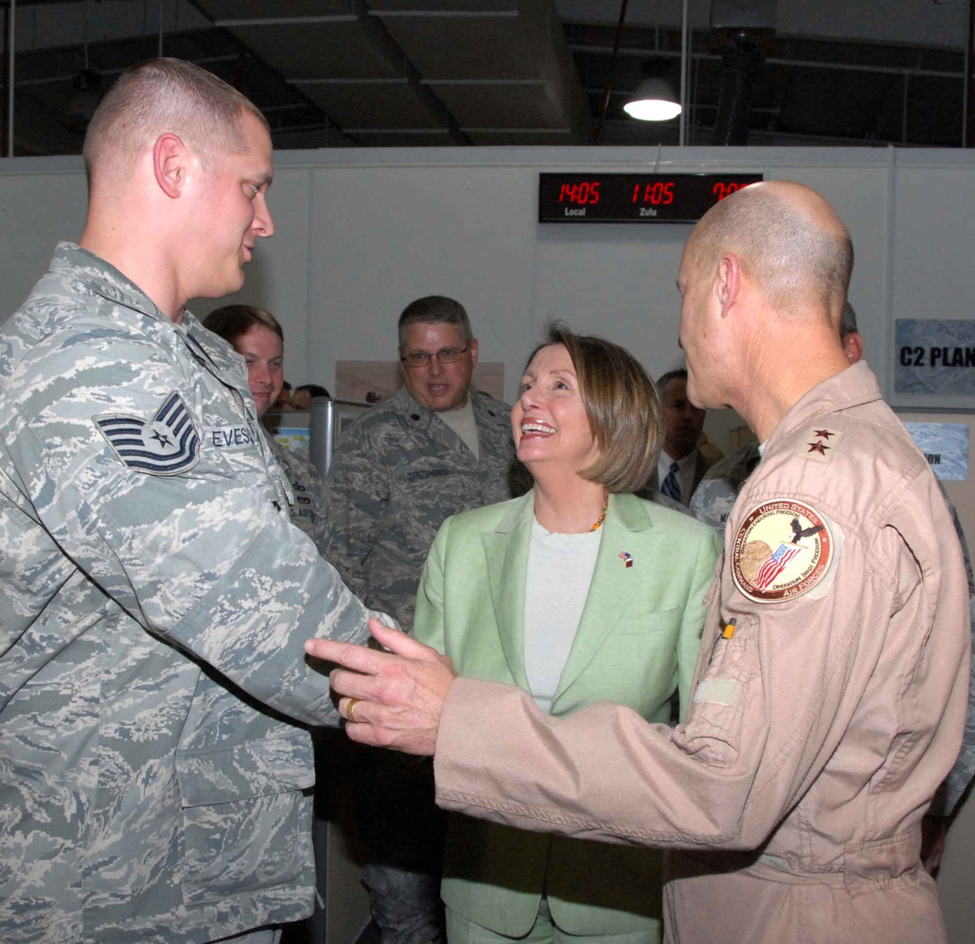 SOUTHWEST ASIA -- Maj. Gen. Douglas Raaberg, Deputy Combined Force Air Component Commander U.S. Central Command, introduces Tech. Sgt. Scott Levesque to Speaker of the U.S. House of Representatives Nancy Pelosi (D-Calif.) May 8, 2009, during a visit to the Combined Air and Space Operations Center at an undisclosed location in Southwest Asia. Sergeant Levesque, the COAC executive communications support NCO, is deployed from Scott Air Force Base, Ill., and hails from Gardner, Mass. (U.S. Air Force photo by Chief Master Sgt. Lemuel Casillas)