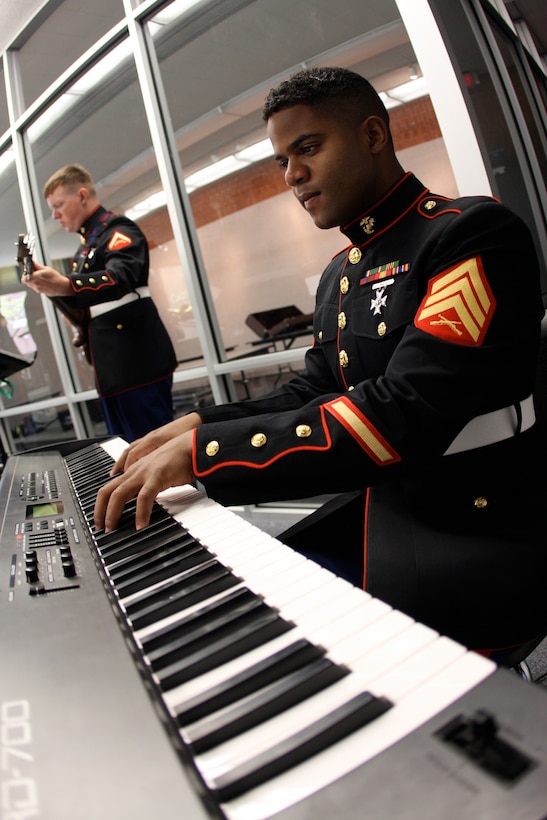 Sgt. Victor Diaz, a piano player with the combat Center band, jazzes out during a jazz band concert and Highland High School in Highland, Ill., Tuesday. The Highland High School students were not the only ones to enjoy a free show from the band during Marine Week May 11 to 17.