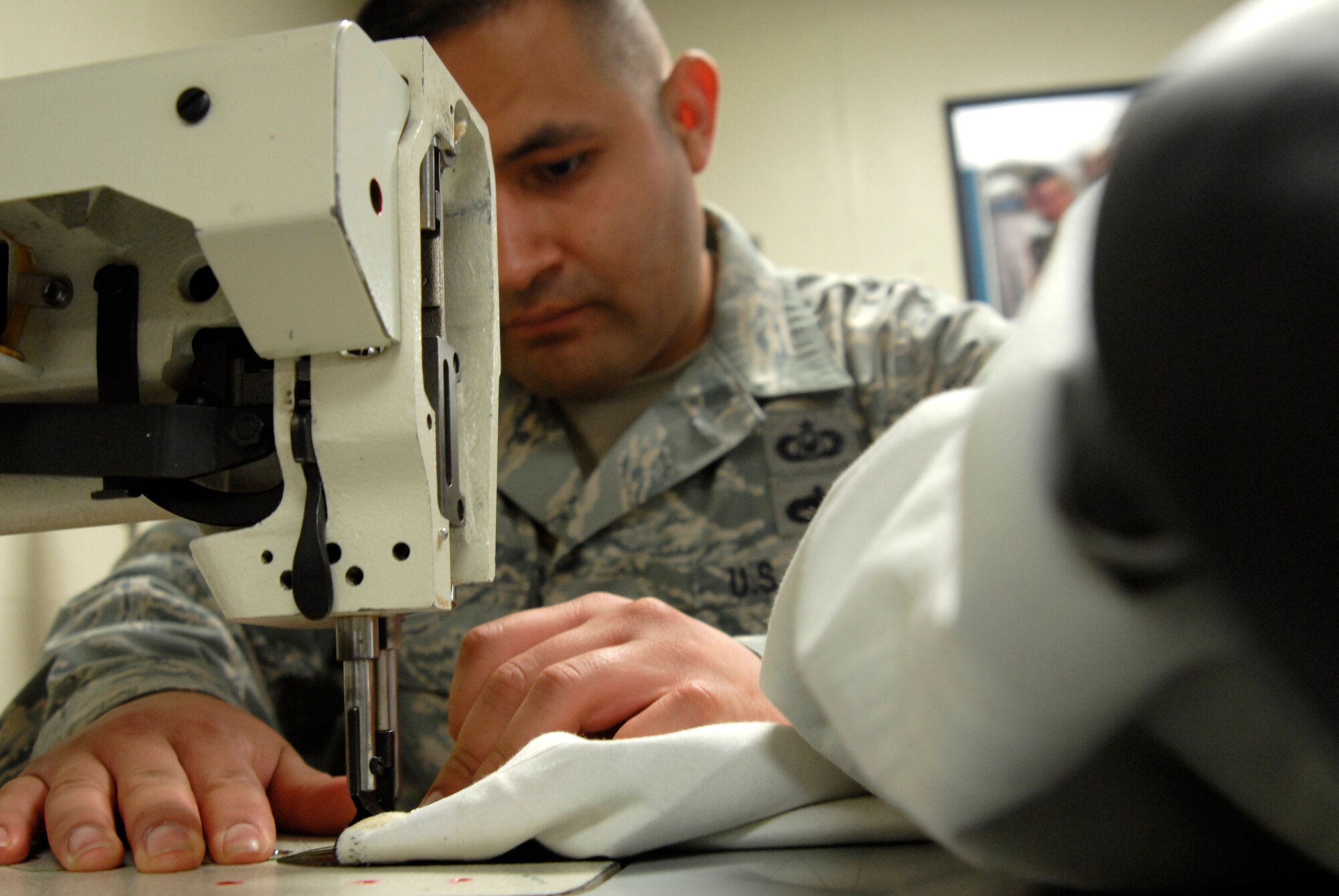 Staff Sgt Rey Andrade, an aircrew flight equipment technician assigned to the 8th Operations Support Squadron, ensures that the seal on an anit-exposure suit is secured at Kunsan Air Base, Republic of Korea. Aircrew flight equipment technicians are responsible for all of the equipment that will save a pilots life in the event the pilot has to eject from the aircraft. (U.S. Air Force Photo by Staff Sgt Jason Colbert)




